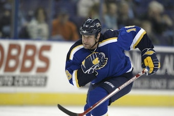 ST. LOUIS - JANUARY 26: Mike Sillinger #18 of the St. Louis Blues skates to the puck during the game against the Phoenix Coyotes on January 26, 2006 at the Savvis Center in St. Louis, Missouri. The Phoenix Coyotes defeated the St. Louis Blues 5-3. (Photo 