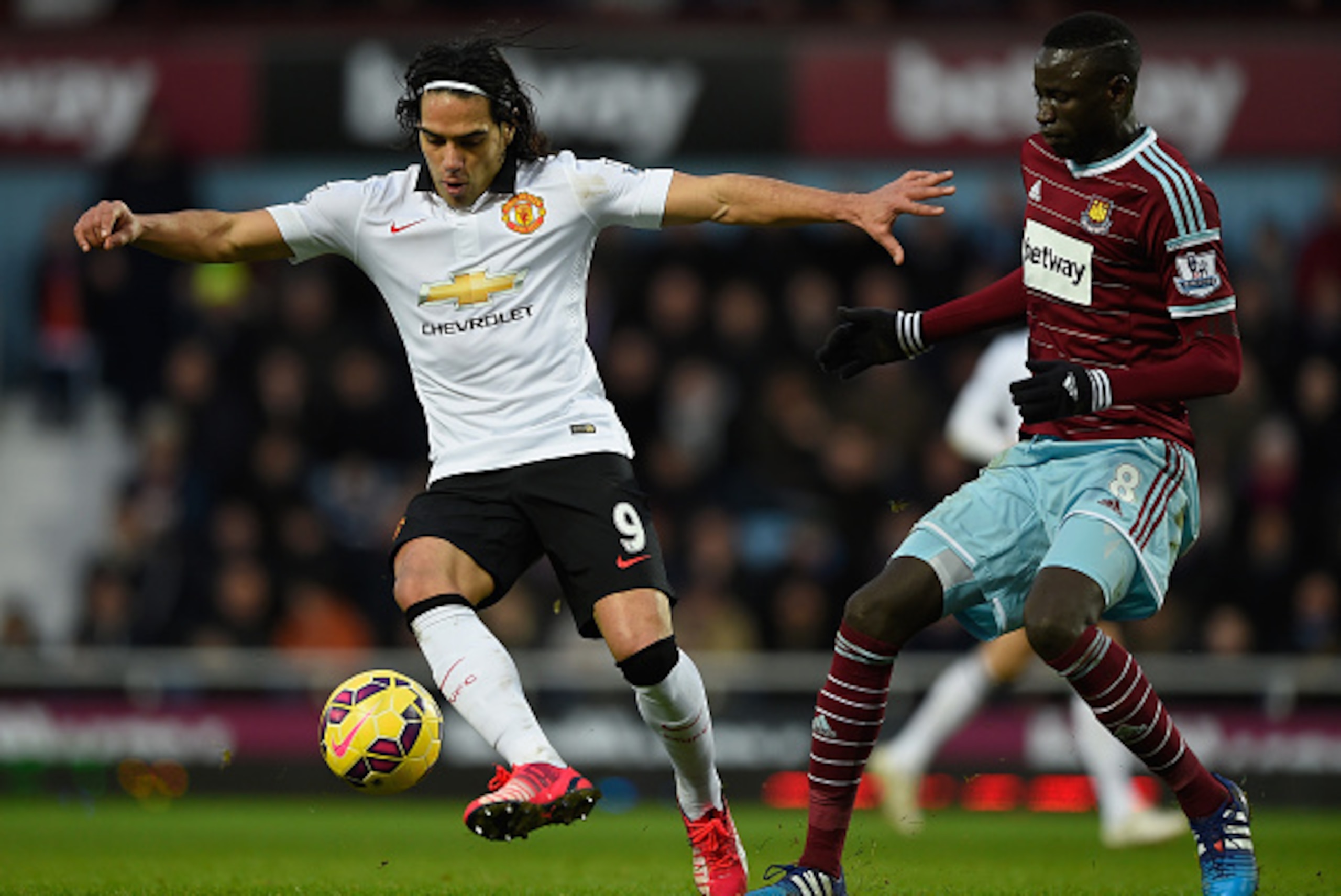LONDON, ENGLAND - FEBRUARY 08:  Radamel Falcao of Manchester United is challenged by Cheikhou Kouyate of West Ham during the Barclays Premier League match between West Ham United and Manchester United at Boleyn Ground on February 8, 2015 in London, Englan