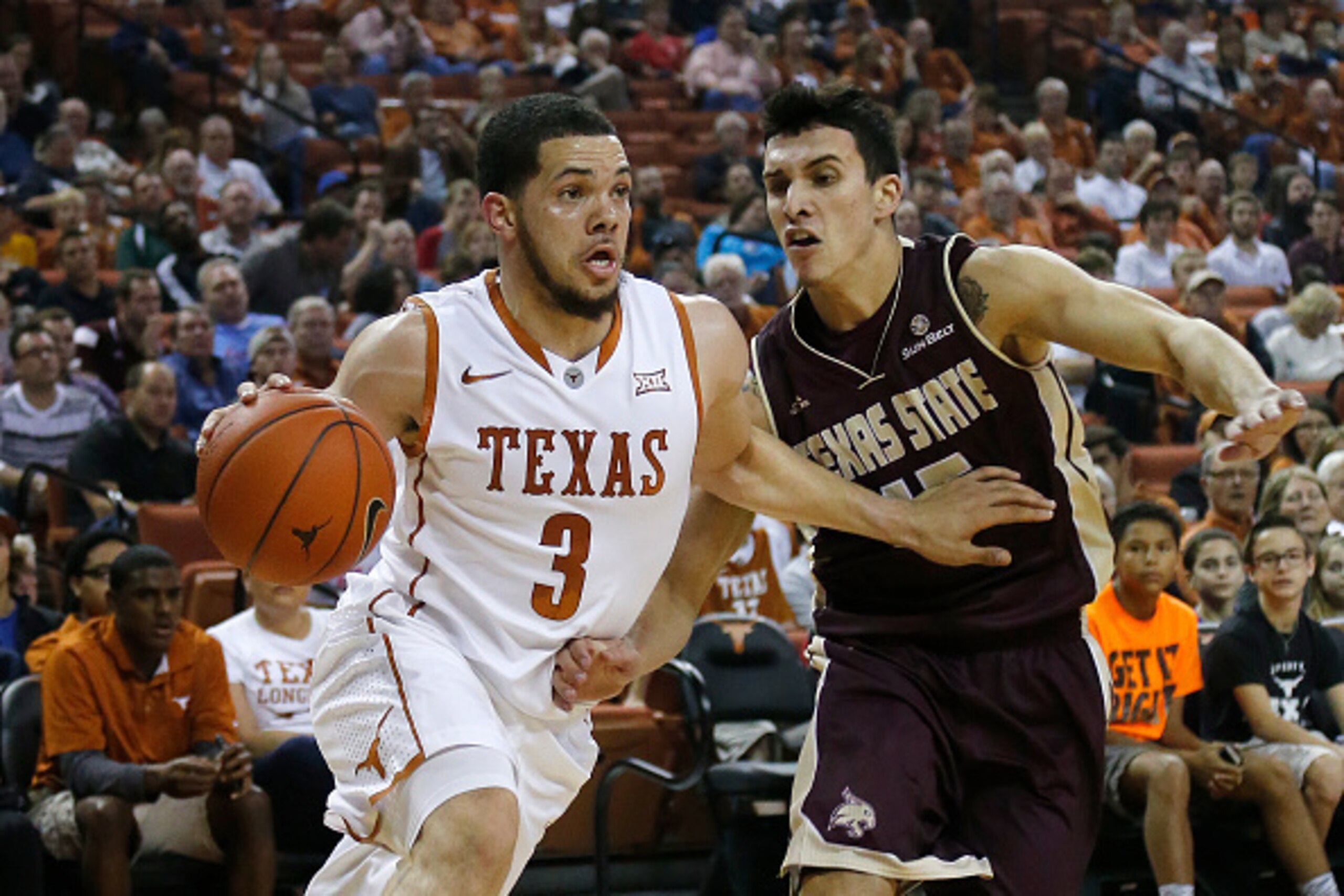 AUSTIN, TX - DECEMBER 13: Javan Felix #3 of the Texas Longhorns drives around Ethan Montalvo #15 of the Texas State Bobcats at the Frank Erwin Center on December 13, 2014 in Austin, Texas. (Photo by Chris Covatta/Getty Images)