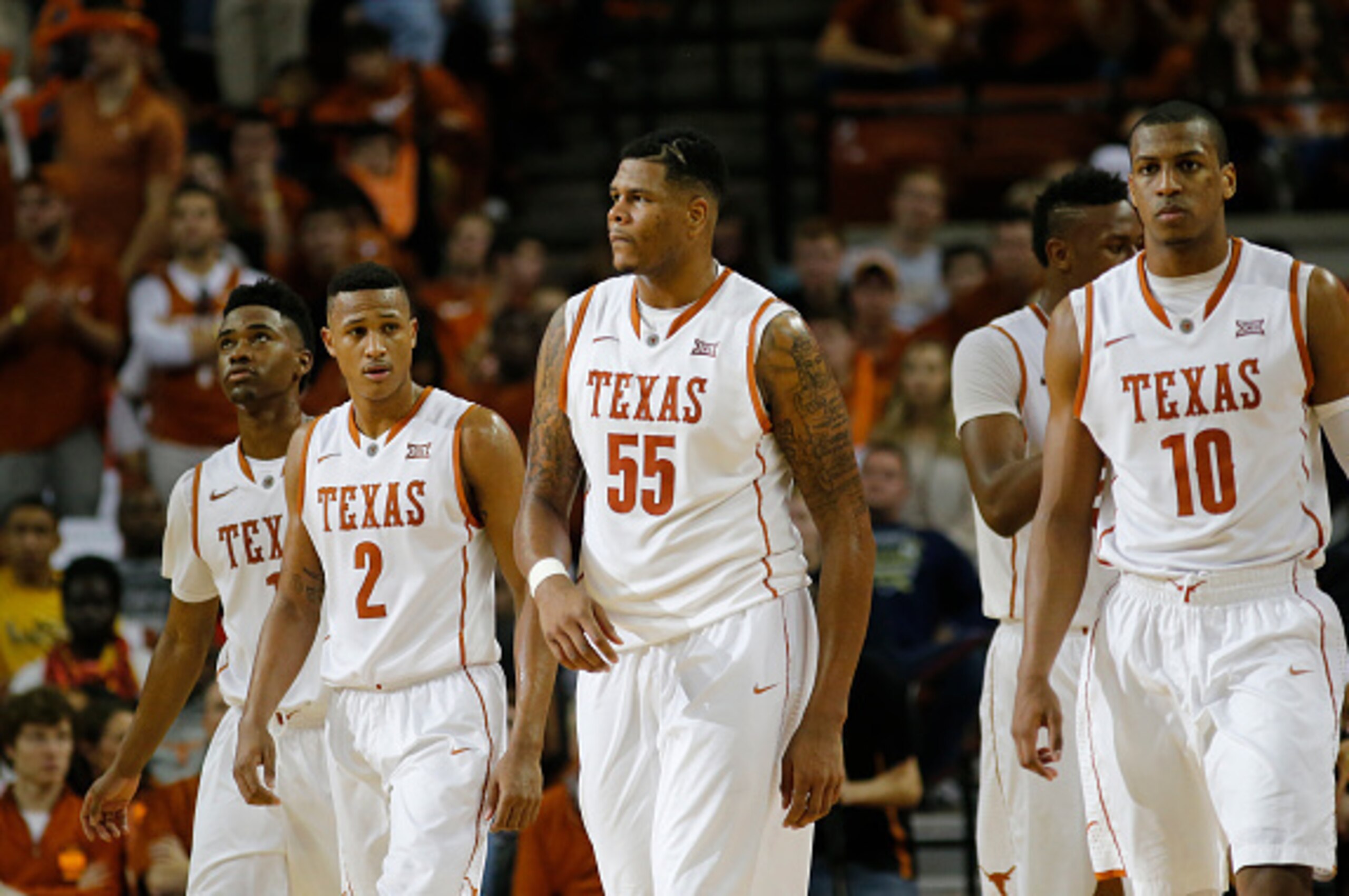 AUSTIN, TX - JANUARY 24: (Left to right) Isaiah Taylor #1, Demarcus Holland #2, Cameron Ridley #55 and Jonathan Holmes #10 of the Texas Longhorns walk on the court during the game with the Kansas Jayhawks at the Frank Erwin Center on January 24, 2015 in A