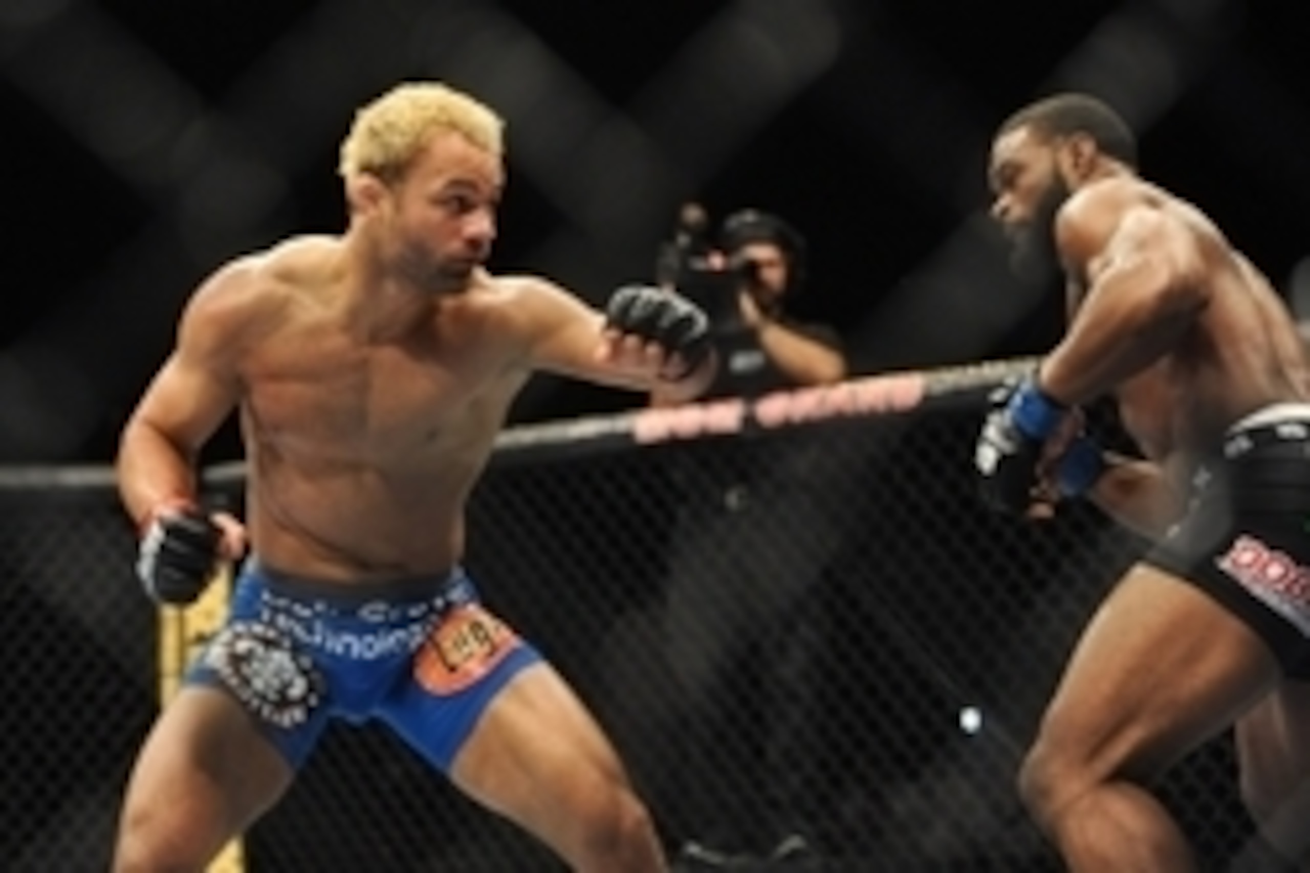 Nov 16, 2013; Las Vegas, NV, USA; Josh Koscheck (red gloves) fights against Tyron Woodley (blue gloves) in their welterweight bout during UFC 167 at MGM Grand Garden Arena. Mandatory Credit: Stephen R. Sylvanie-USA TODAY Sports Nov 16, 2013; Las Vegas, NV, USA; Josh Koscheck (red gloves) fights against Tyron Woodley (blue gloves) in their welterweight bout during UFC 167 at MGM Grand Garden Arena. Mandatory Credit: Stephen R. Sylvanie-USA TODAY Sports