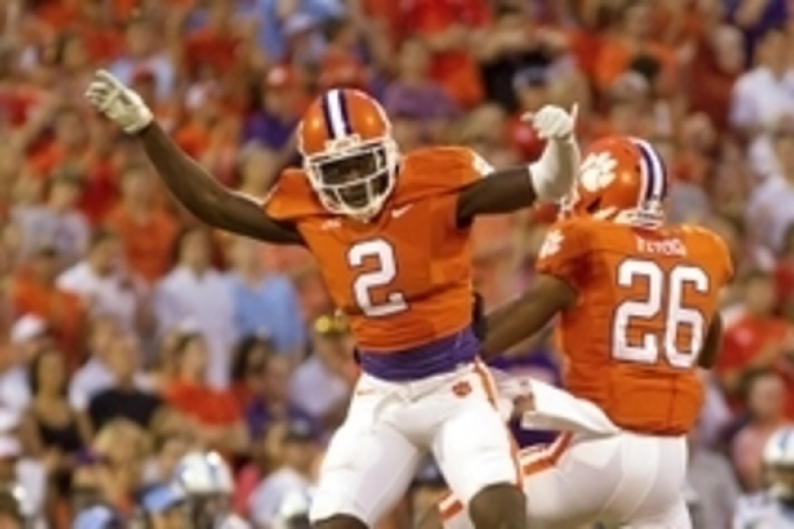 Sep 27, 2014; Clemson, SC, USA; Clemson Tigers cornerback MacKensie Alexander (2) and cornerback Garry Peters (26) celebrate after breaking up a pass during the first quarter against the North Carolina Tar Heels at Clemson Memorial Stadium. Mandatory Cred