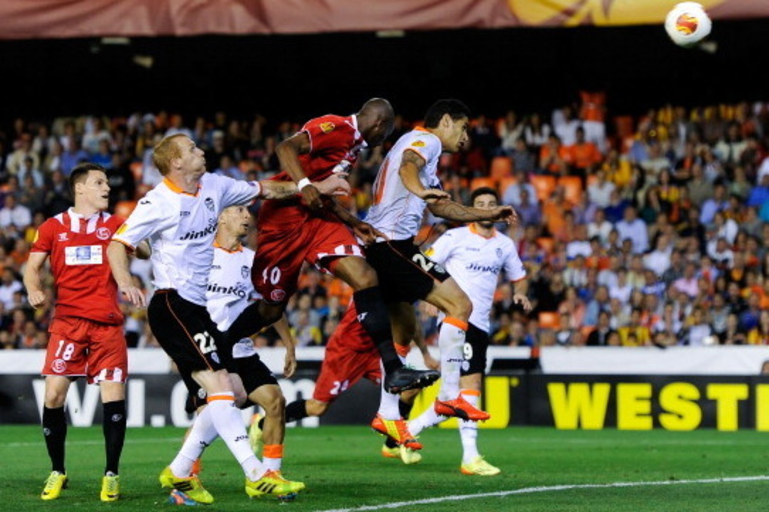VALENCIA, SPAIN - MAY 01:  Stephane Mbia of Sevilla FC scores his team's first goal during the UEFA Europa League Semi Final second leg match between Valencia CF and Sevilla FC at Estadi de Mestalla on May 1, 2014 in Valencia, Spain.  (Photo by David Ramo