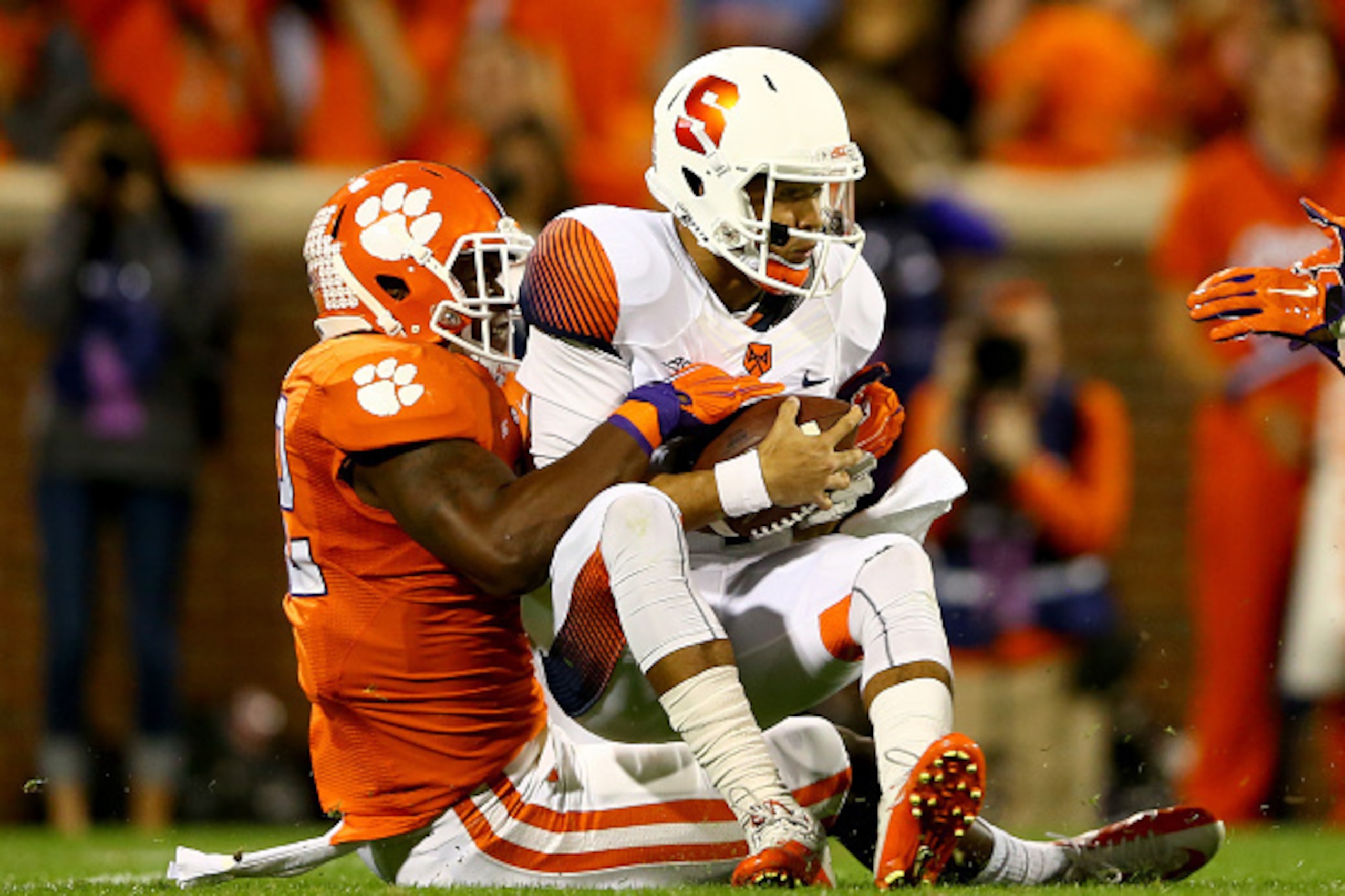 CLEMSON, SC - OCTOBER 25:  Stephone Anthony #42 of the Clemson Tigers sacks AJ Long #4 of the Syracuse Orange during their game at Memorial Stadium on October 25, 2014 in Clemson, South Carolina.  (Photo by Streeter Lecka/Getty Images)