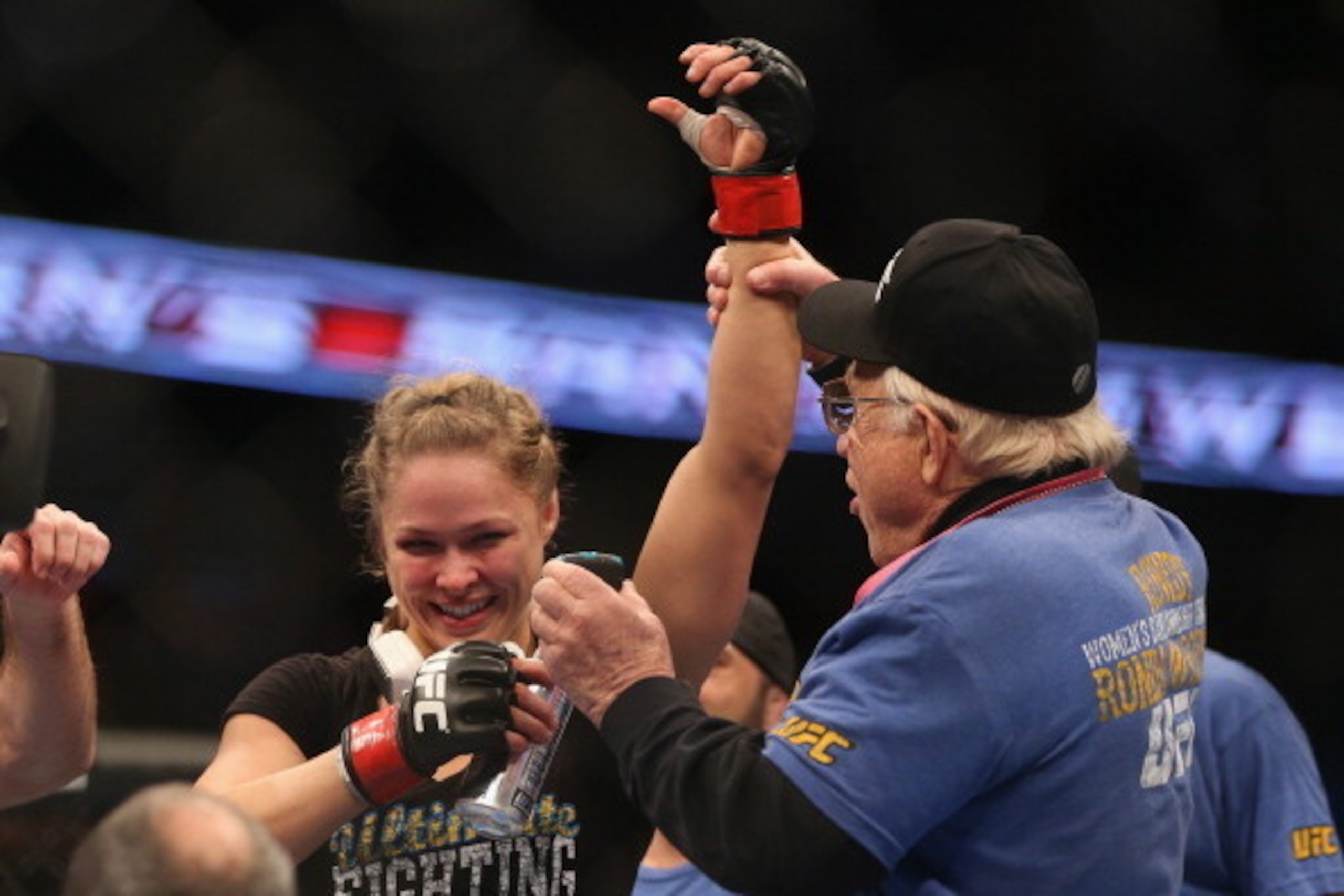 ANAHEIM, CA - FEBRUARY 23: Ronda Rousey celebrates her UFC Bantamweight Title over Liz Carmouche with a member of her team during UFC 157 at Honda Center on February 23, 2013 in Anaheim, California. (Photo by Jeff Gross/Getty Images) ANAHEIM, CA - FEBRUARY 23: Ronda Rousey celebrates her UFC Bantamweight Title over Liz Carmouche with a member of her team during UFC 157 at Honda Center on February 23, 2013 in Anaheim, California. (Photo by Jeff Gross/Getty Images)