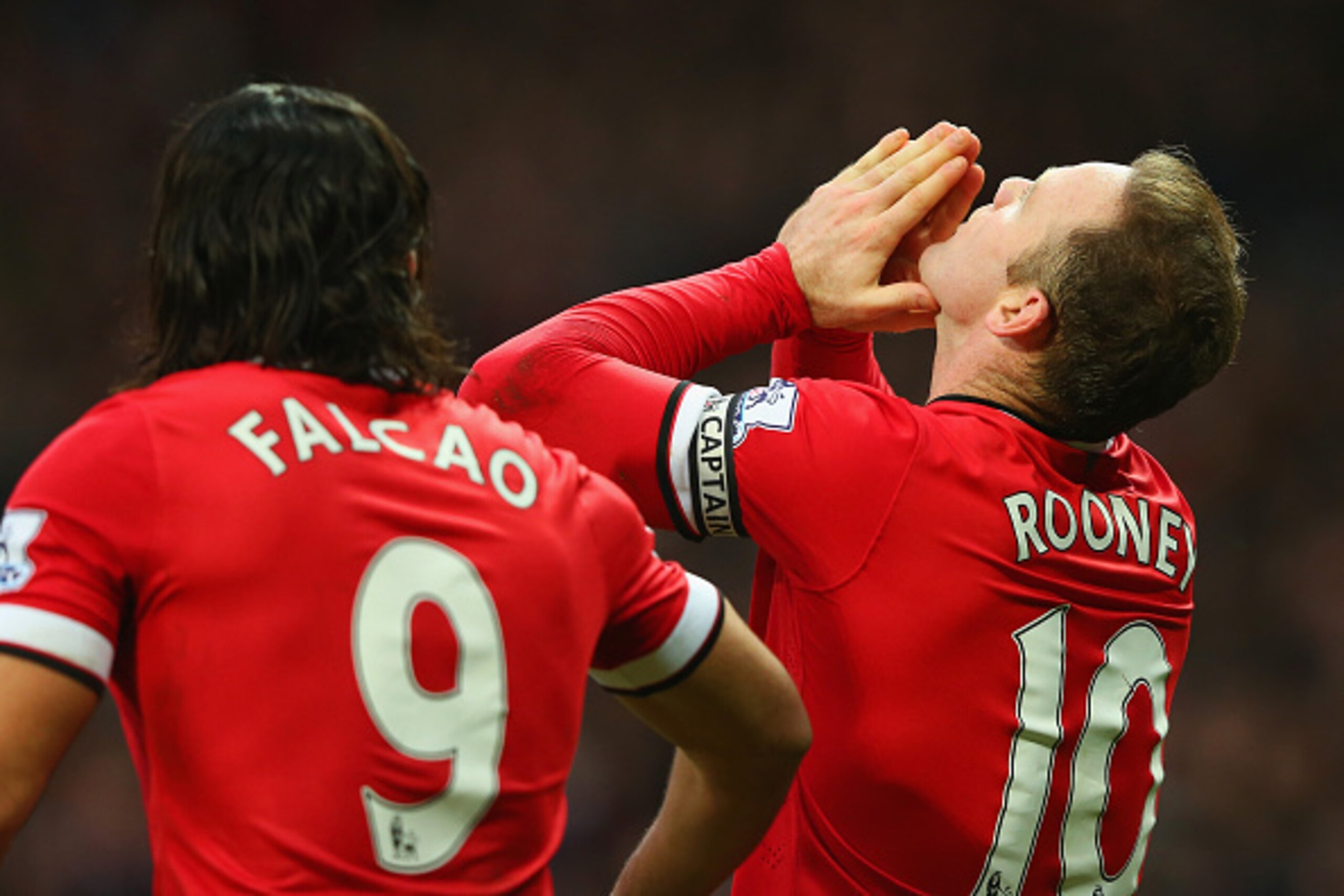 MANCHESTER, ENGLAND - FEBRUARY 28:  Wayne Rooney of Manchester United celebrates scoring the opening goal with Radamel Falcao García of Manchester United  during the Barclays Premier League match between Manchester United and Sunderland at Old Trafford on