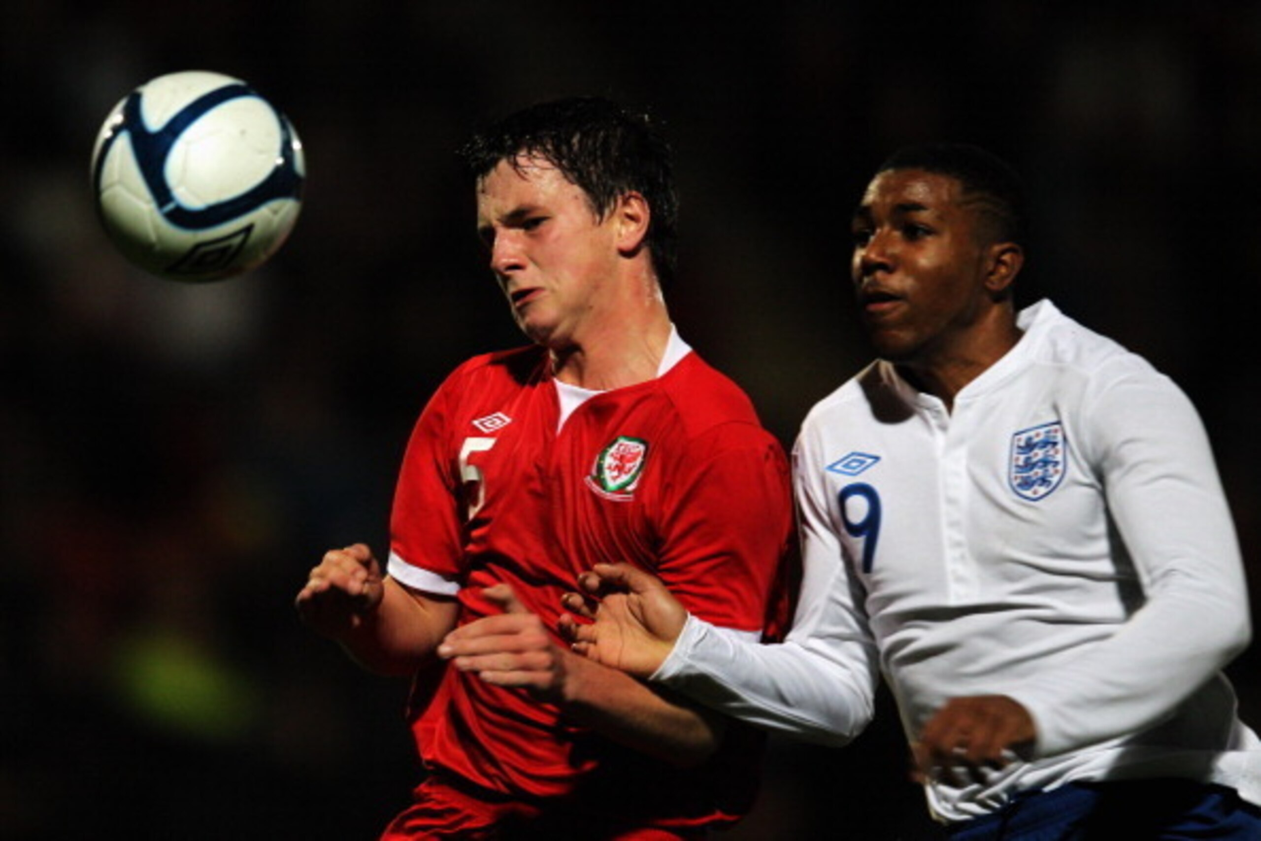 CHELTENHAM, ENGLAND - OCTOBER 27: Jerome Sinclair of England and Ross White of Wales battle for the ball during the The Sky Sports Victory Shield between England U16 and Wales U16 at The Abbey Business Stadium on October 27, 2011 in Cheltenham, England. CHELTENHAM, ENGLAND - OCTOBER 27: Jerome Sinclair of England and Ross White of Wales battle for the ball during the The Sky Sports Victory Shield between England U16 and Wales U16 at The Abbey Business Stadium on October 27, 2011 in Cheltenham, England.