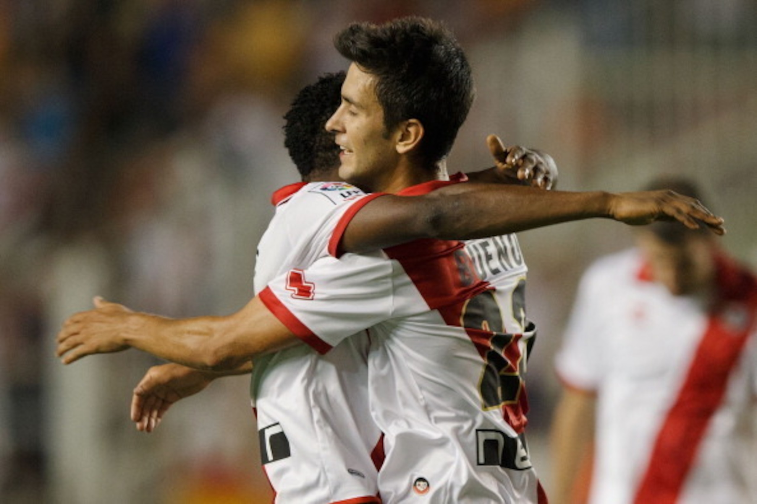 MADRID, SPAIN - AUGUST 19:  Alberto Bueno (R) of Rayo Vallecano de Madrid celebrates scoring their third goal with teammate Alhassane Bangoura alias Lass (L) during the La Liga match between Rayo Vallecano de Madrid and Elche FC at Estadio Teresa Rivero o