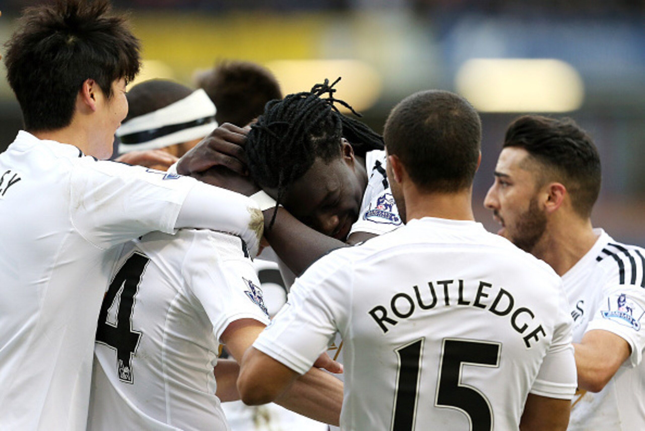 BURNLEY, ENGLAND - FEBRUARY 28:  Jack Cork (2nd L) of Swansea City is congratulated by teamates after his shot is deflected for an own goal during the Barclays Premier League match between Burnley and Swansea City at Turf Moor on February 28, 2015 in Burn
