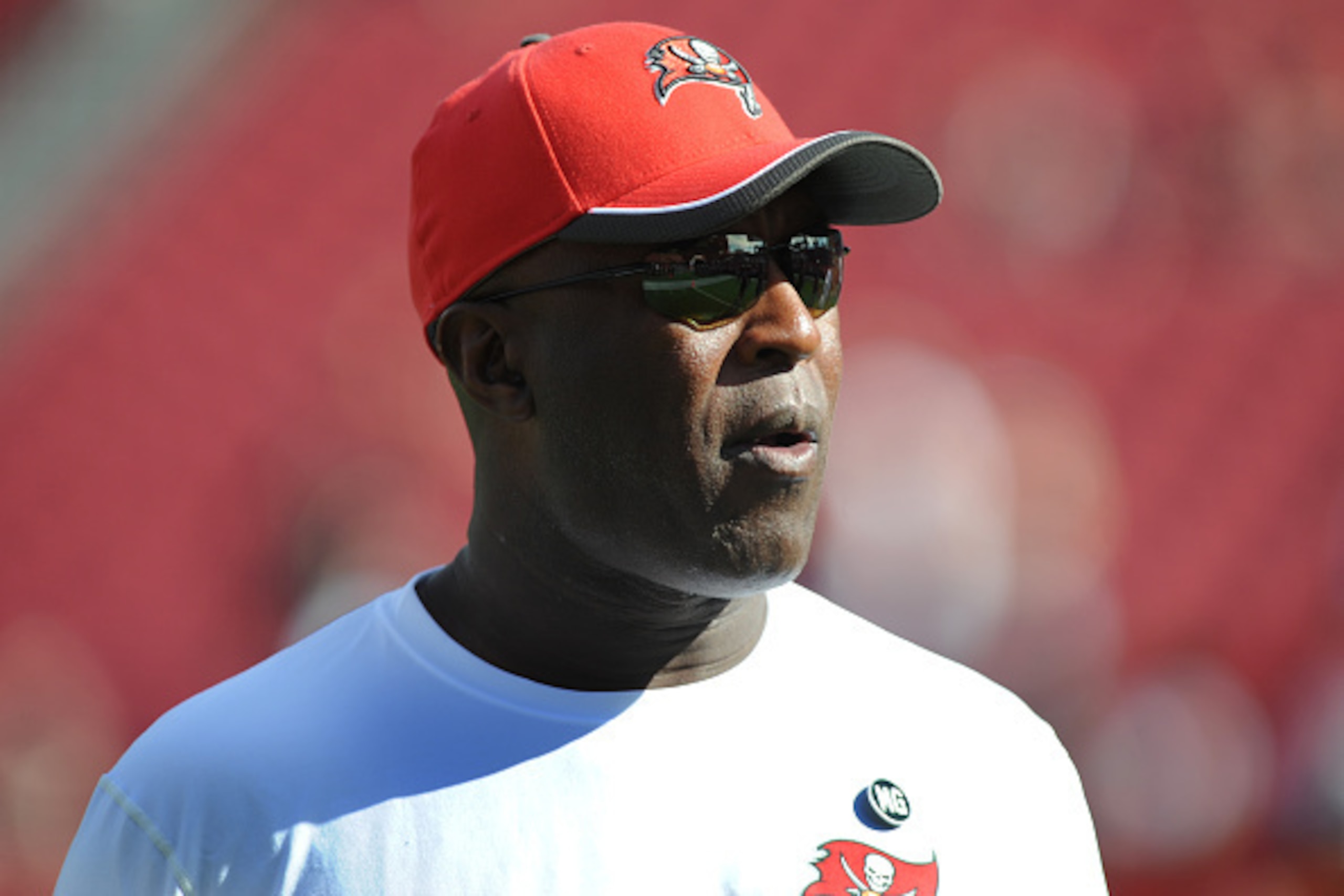 TAMPA, FL - DECEMBER 28: Head coach Lovie Smith of the Tampa Bay Buccaneers stands on the field during pregame warmups at Raymond James Stadium on December 28, 2014 in Tampa, Florida. (Photo by Cliff McBride/Getty Images)