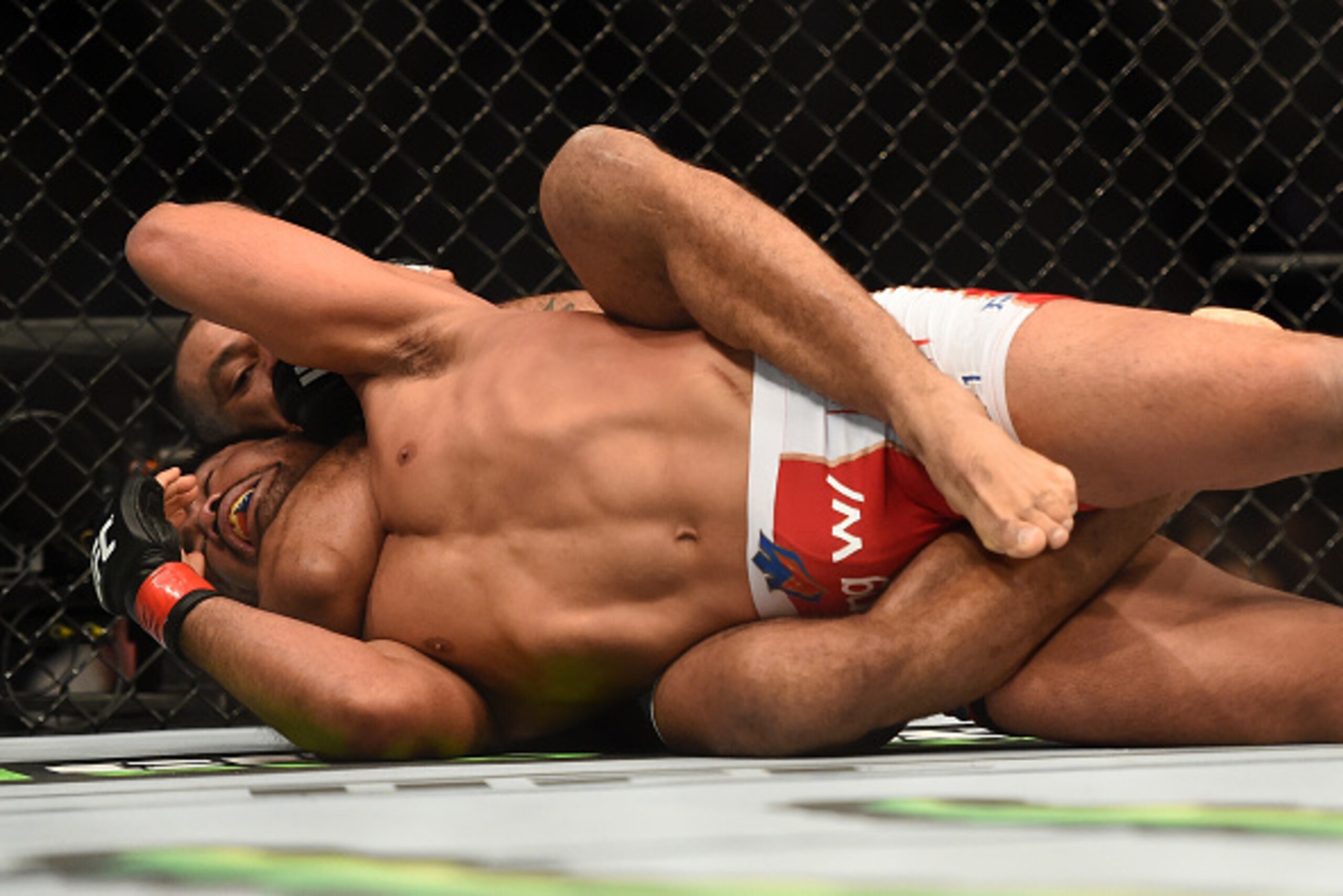 LOS ANGELES, CA - FEBRUARY 28:  (Behind) Roan Carneiro submits Mark Munoz in their middleweight bout during the UFC 184 event at Staples Center on February 28, 2015 in Los Angeles, California.  (Photo by Harry How/Getty Images)