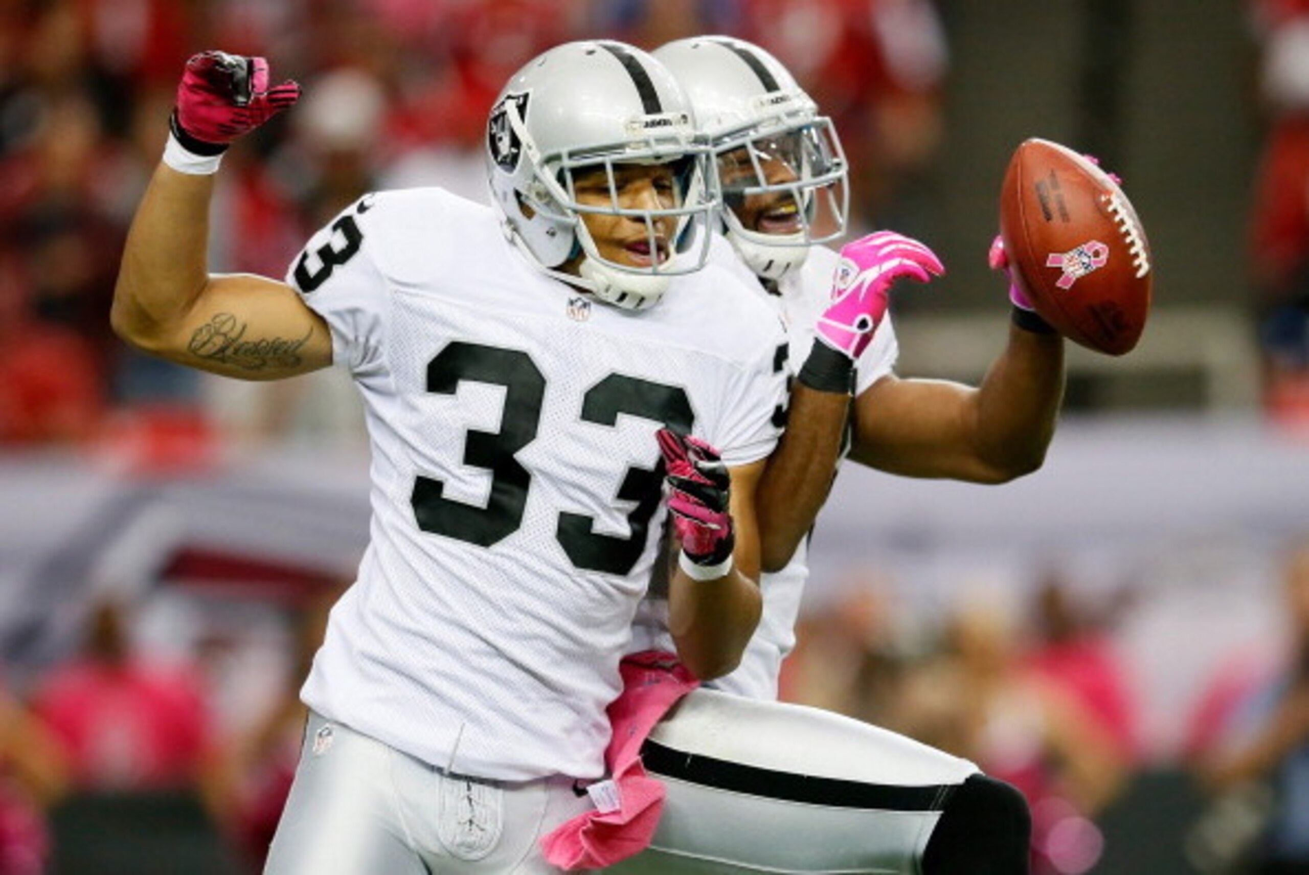 ATLANTA, GA - OCTOBER 14: Michael Huff #24 of the Oakland Raiders celebrates with Tyvon Branch #33 after Huff's intercetion against the Atlanta Falcons at Georgia Dome on October 14, 2012 in Atlanta, Georgia. (Photo by Kevin C. Cox/Getty Images) ATLANTA, GA - OCTOBER 14: Michael Huff #24 of the Oakland Raiders celebrates with Tyvon Branch #33 after Huff's intercetion against the Atlanta Falcons at Georgia Dome on October 14, 2012 in Atlanta, Georgia. (Photo by Kevin C. Cox/Getty Images)