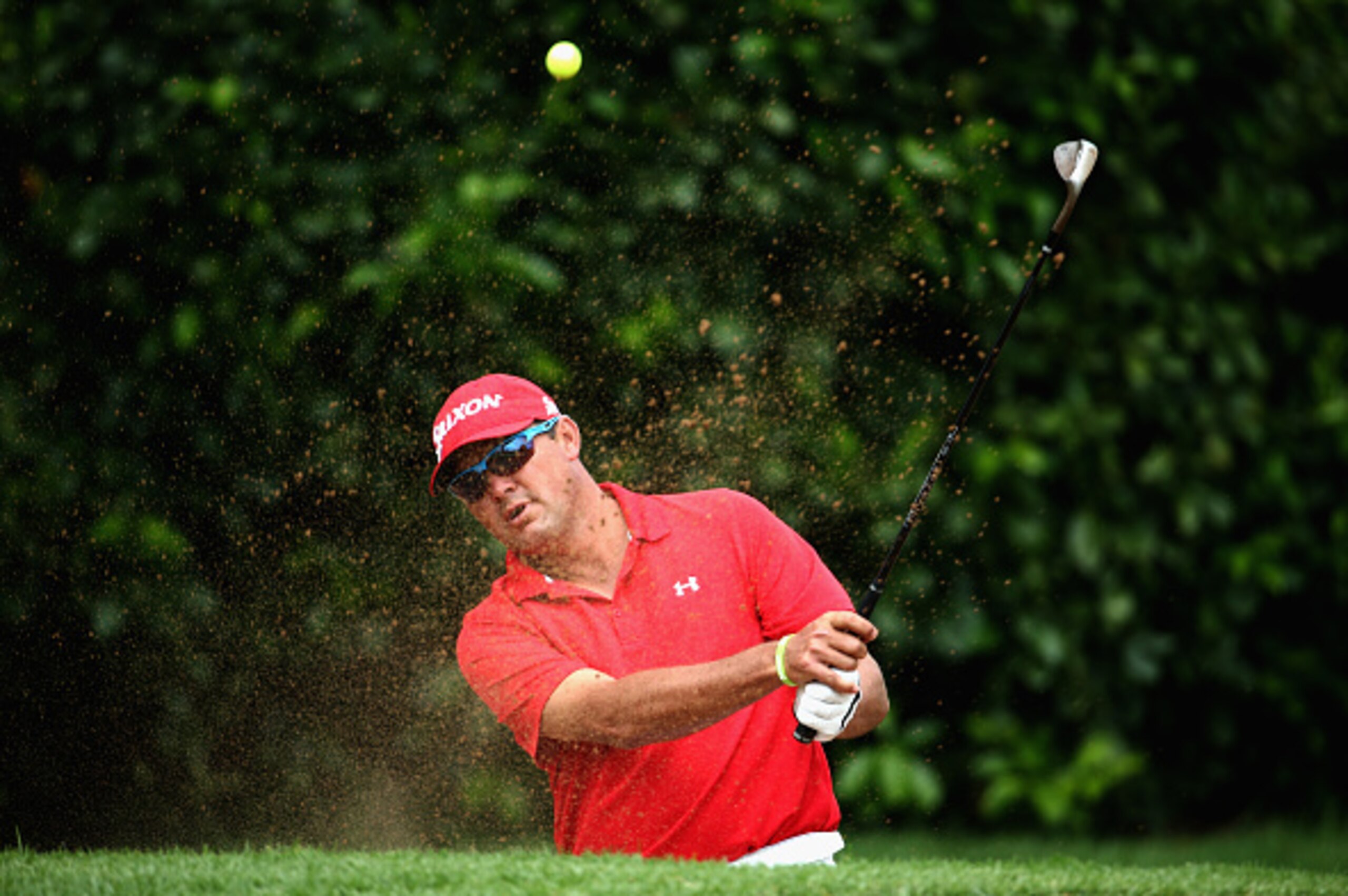 JOHANNESBURG, SOUTH AFRICA - MARCH 01:  Wallie Coetsee of South Africa plays out of the first greenside bunker during the final round of the Joburg Open at Royal Johannesburg and Kensington Golf Club on March 1, 2015 in Johannesburg, South Africa.  (Photo