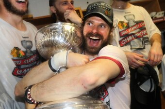 BOSTON, MA - JUNE 24:  Michal Handzus #26 of the Chicago Blackhawks celebrates with the Stanley Cup in the locker room after his team defeated the Boston Bruins 3-2 in Game Six of the 2013 Stanley Cup Final at TD Garden on June 24, 2013 in Boston, Massach