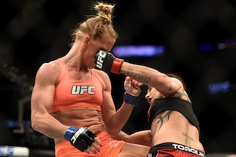 LOS ANGELES, CA - FEBRUARY 28:  (R) Raquel Pennington punches Holly Holm in their women's bantamweight bout during the UFC 184 event at Staples Center on February 28, 2015 in Los Angeles, California.  (Photo by Harry How/Getty Images)