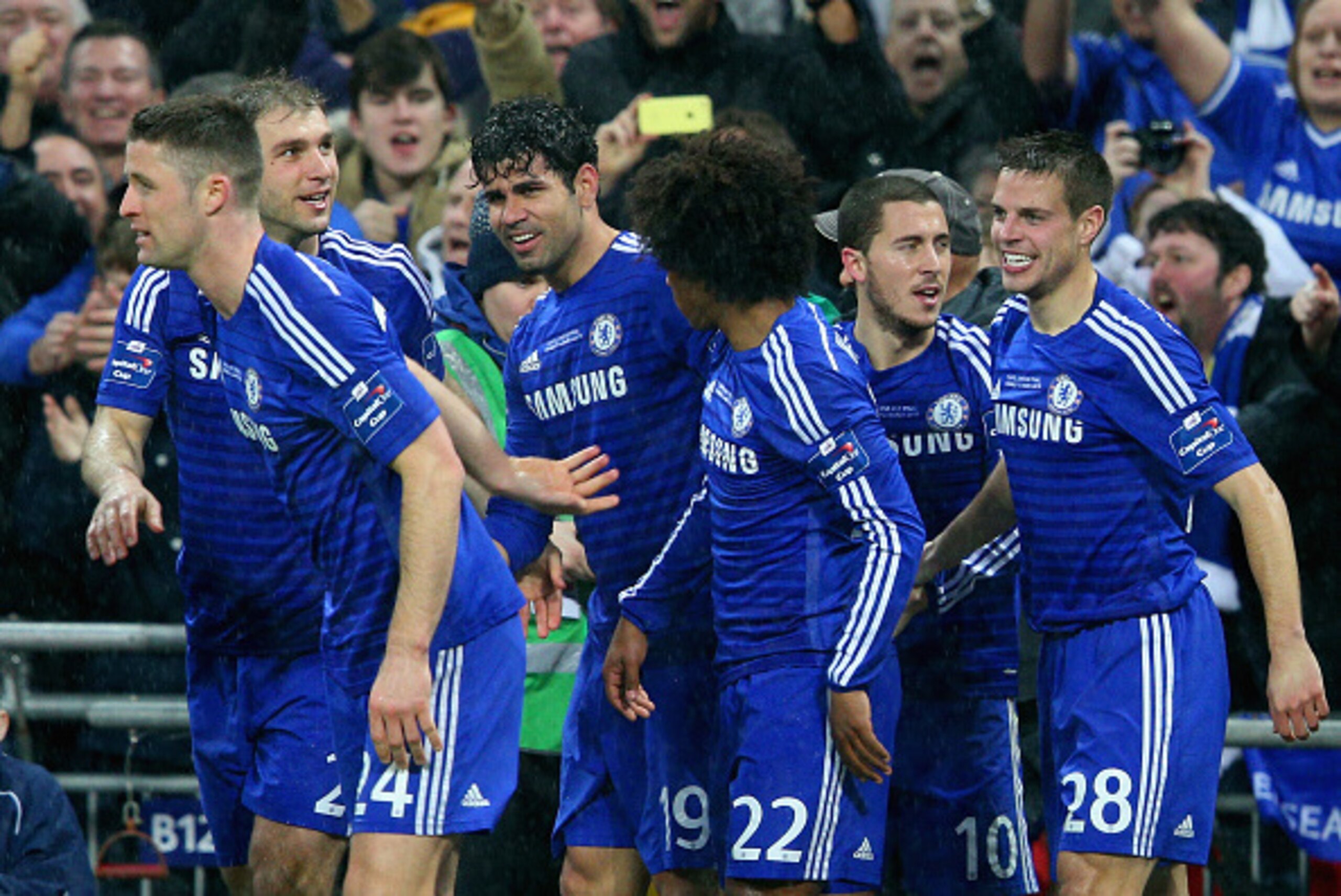 LONDON, ENGLAND - MARCH 01:  Diego Costa of Chelsea celebrates with team mates after his shot on goal is deflected in for a second by Kyle Walker of Spurs during the Capital One Cup Final match between Chelsea and Tottenham Hotspur at Wembley Stadium on M