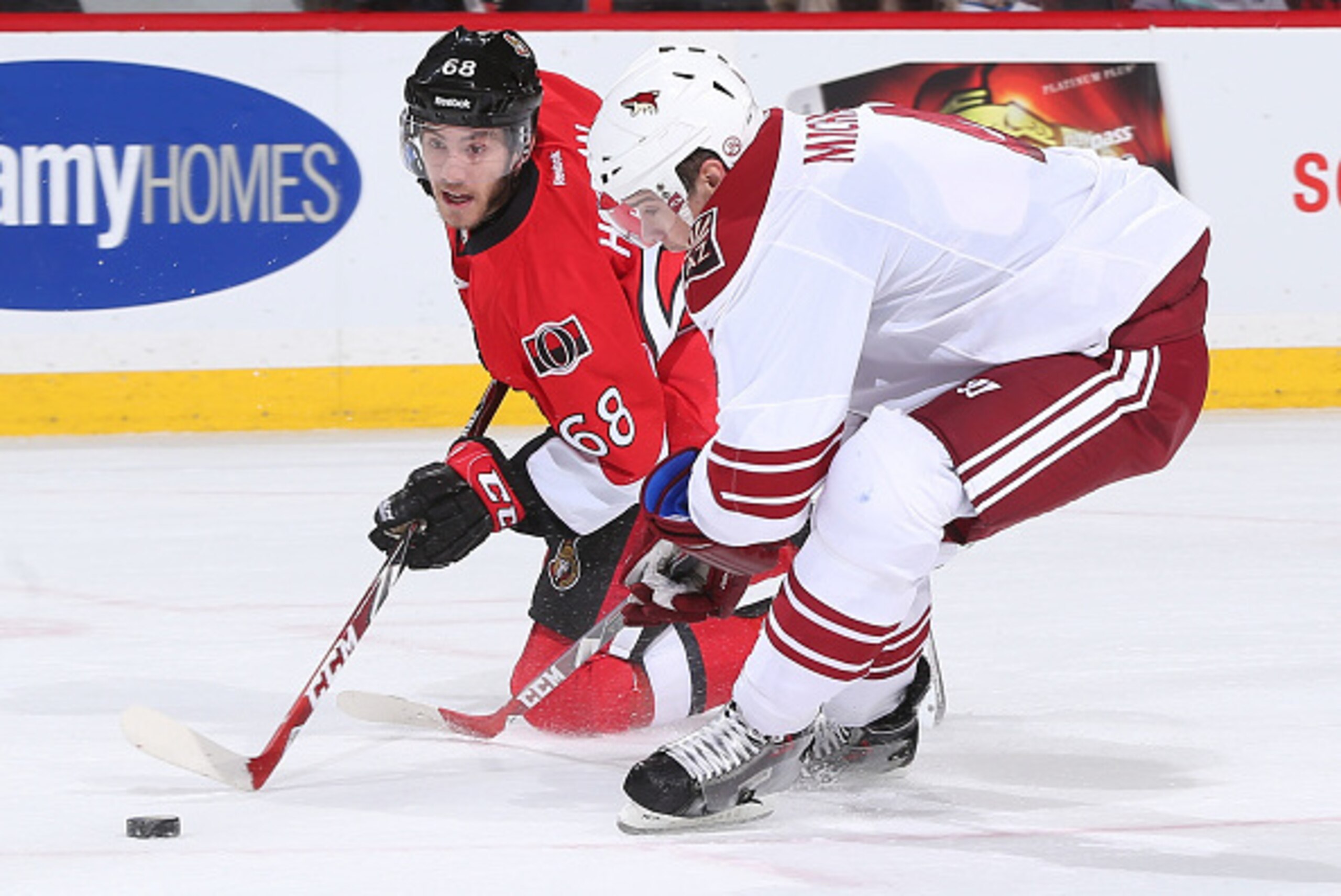 OTTAWA, ON - JANUARY 31: Mike Hoffman #68 of the Ottawa Senators passes the puck from his knees against Zbynek Michalek #4 the Arizona Coyotes at Canadian Tire Centre on January 31, 2015 in Ottawa, Ontario, Canada. (Photo by Andre Ringuette/NHLI via Gett OTTAWA, ON - JANUARY 31: Mike Hoffman #68 of the Ottawa Senators passes the puck from his knees against Zbynek Michalek #4 the Arizona Coyotes at Canadian Tire Centre on January 31, 2015 in Ottawa, Ontario, Canada. (Photo by Andre Ringuette/NHLI via Gett