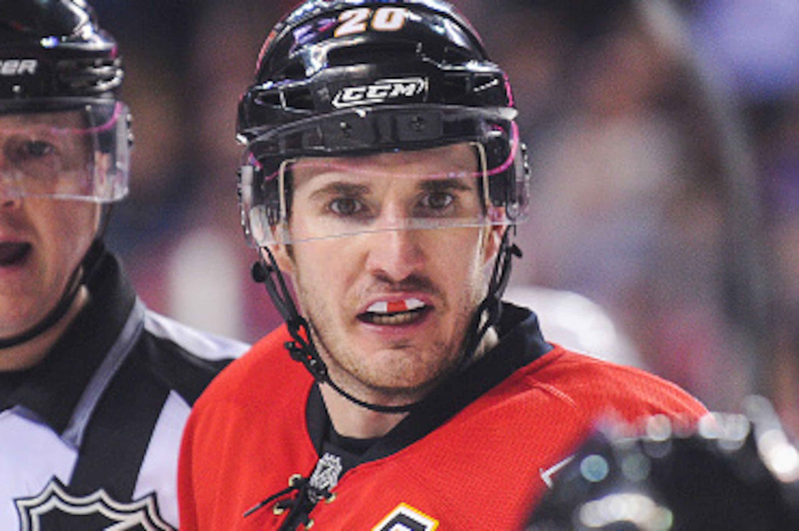 CALGARY, AB - JANUARY 7: Curtis Glencross #20 of the Calgary Flames argues with an official after he called a no goal during an NHL game at Scotiabank Saddledome on January 7, 2015 in Calgary, Alberta, Canada. The Red Wings defeated the Flames 3-2. (Photo