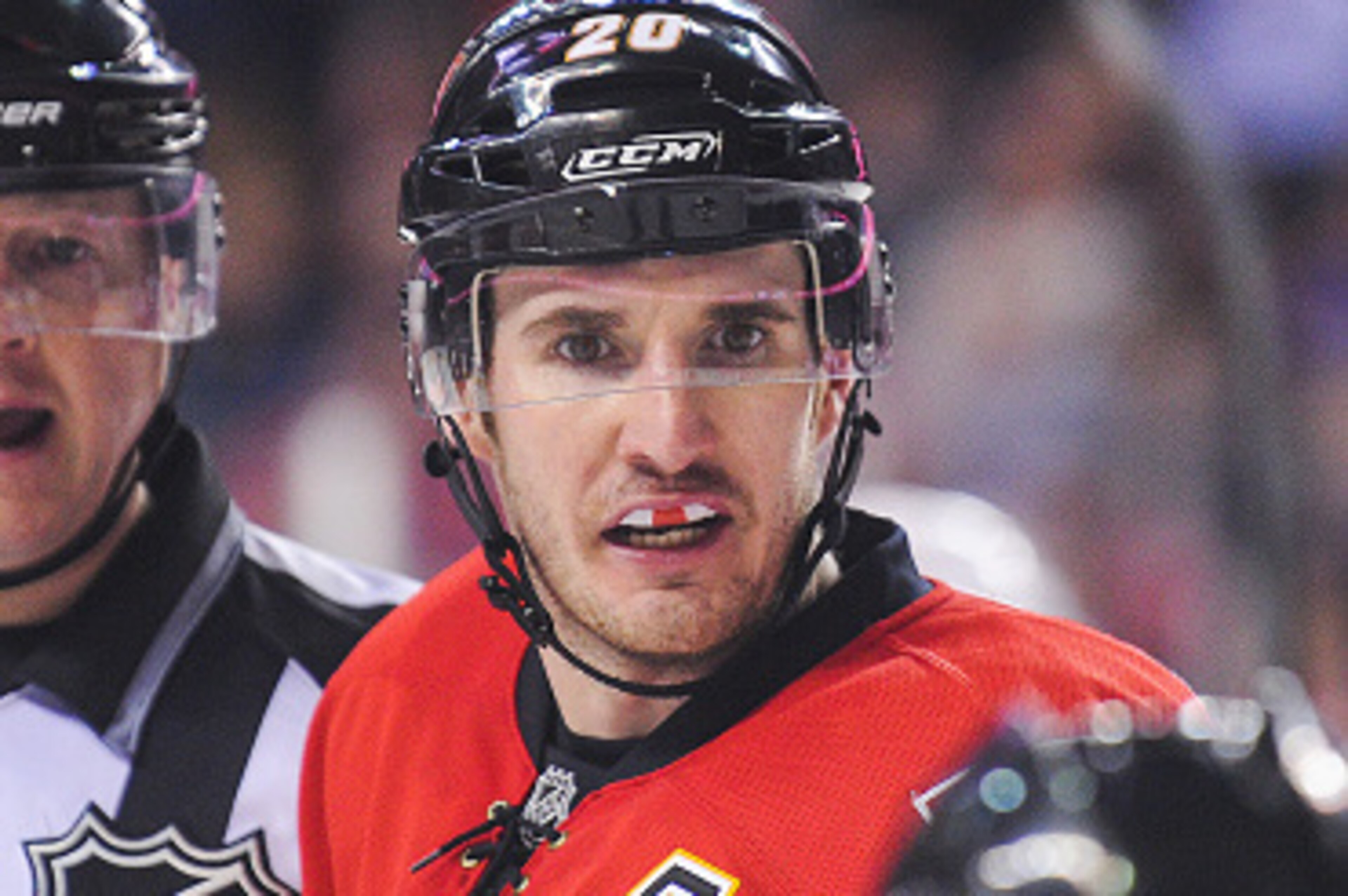 CALGARY, AB - JANUARY 7: Curtis Glencross #20 of the Calgary Flames argues with an official after he called a no goal during an NHL game at Scotiabank Saddledome on January 7, 2015 in Calgary, Alberta, Canada. The Red Wings defeated the Flames 3-2. (Photo