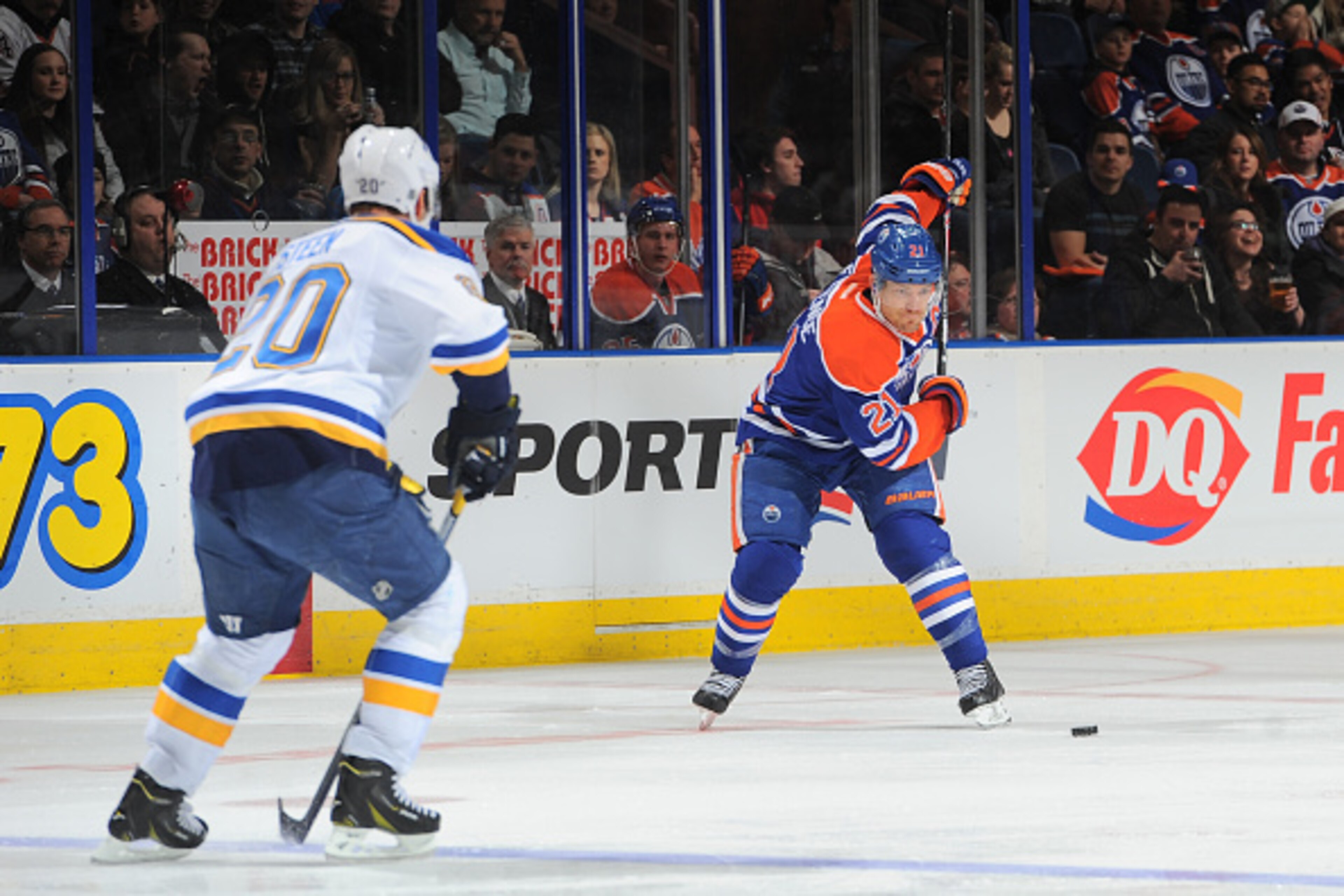 EDMONTON, AB - FEBRUARY 28: Andrew Ference #21 of the Edmonton Oilers takes a slap shot as Alexander Steen #20 attempts to block the shot on February 28, 2015 at Rexall Place in Edmonton, Alberta, Canada. (Photo by Andy Devlin/NHLI via Getty Images)
