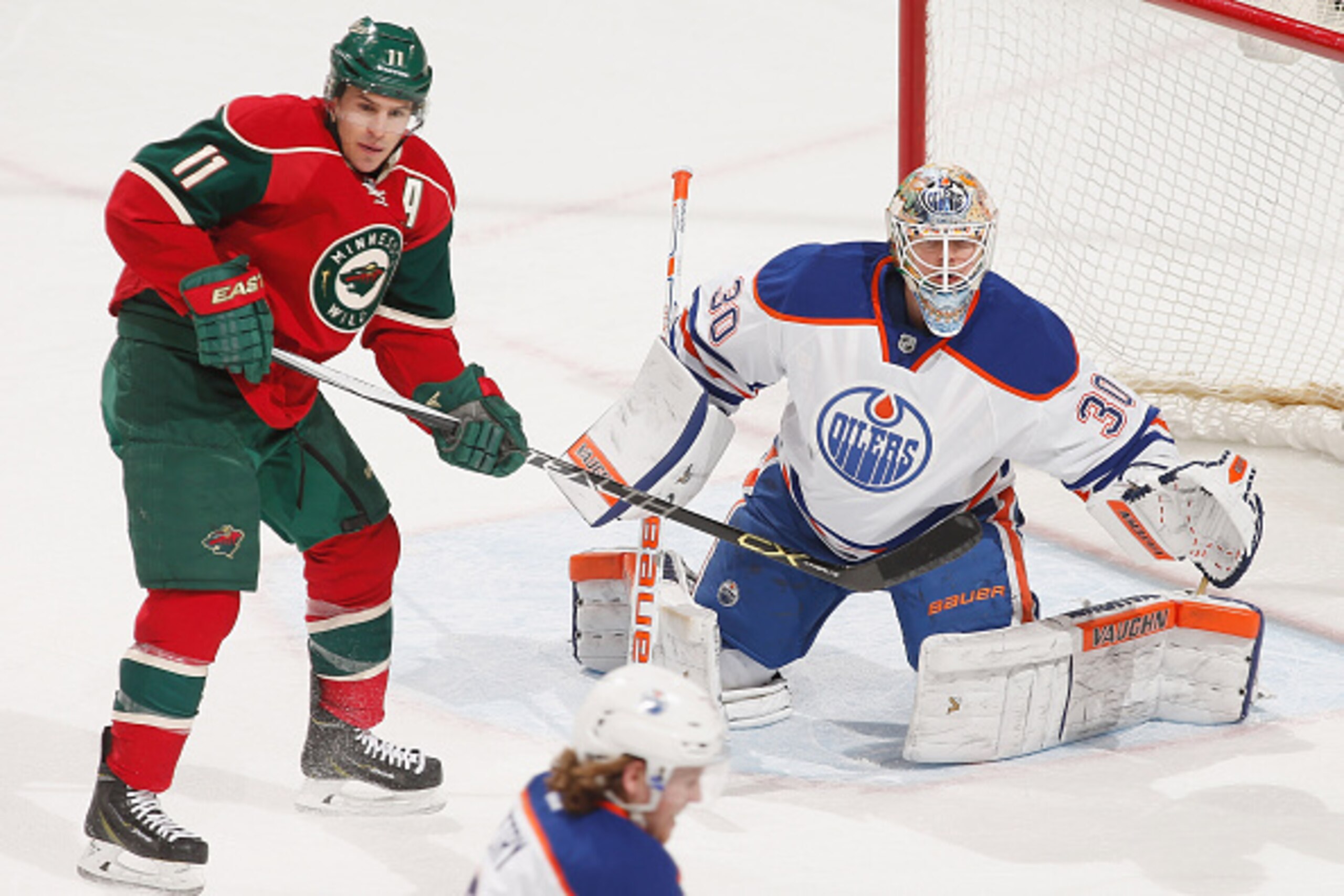 ST. PAUL, MN - FEBRUARY 24: Ben Scrivens #30 of the Edmonton Oilers defends his goal against Zach Parise #11 of the Minnesota Wild during the game on February 24, 2015 at the Xcel Energy Center in St. Paul, Minnesota. (Photo by Bruce Kluckhohn/NHLI via Ge