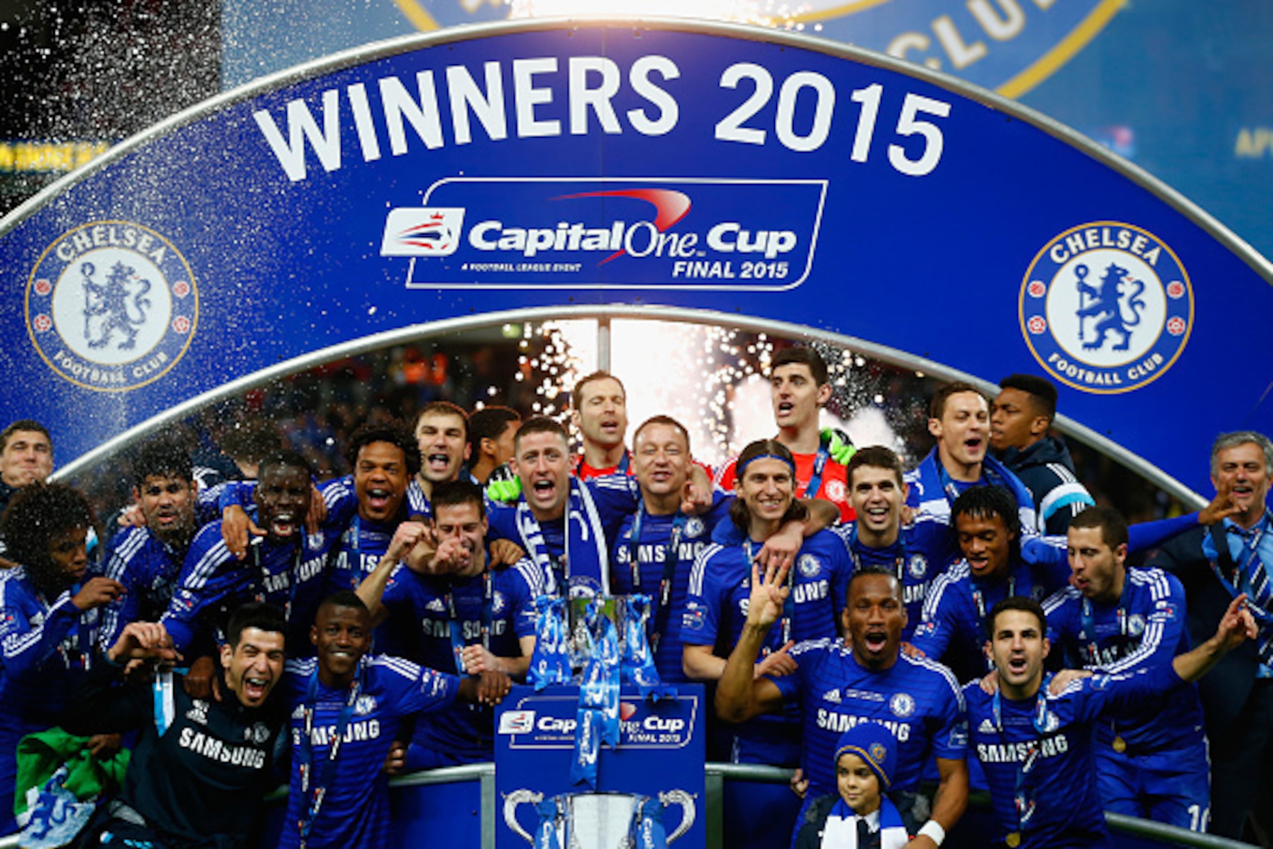 LONDON, ENGLAND - MARCH 01:  Captain John Terry of Chelsea poses with team mates and the trophy during the Capital One Cup Final match between Chelsea and Tottenham Hotspur at Wembley Stadium on March 1, 2015 in London, England.  (Photo by Clive Rose/Gett