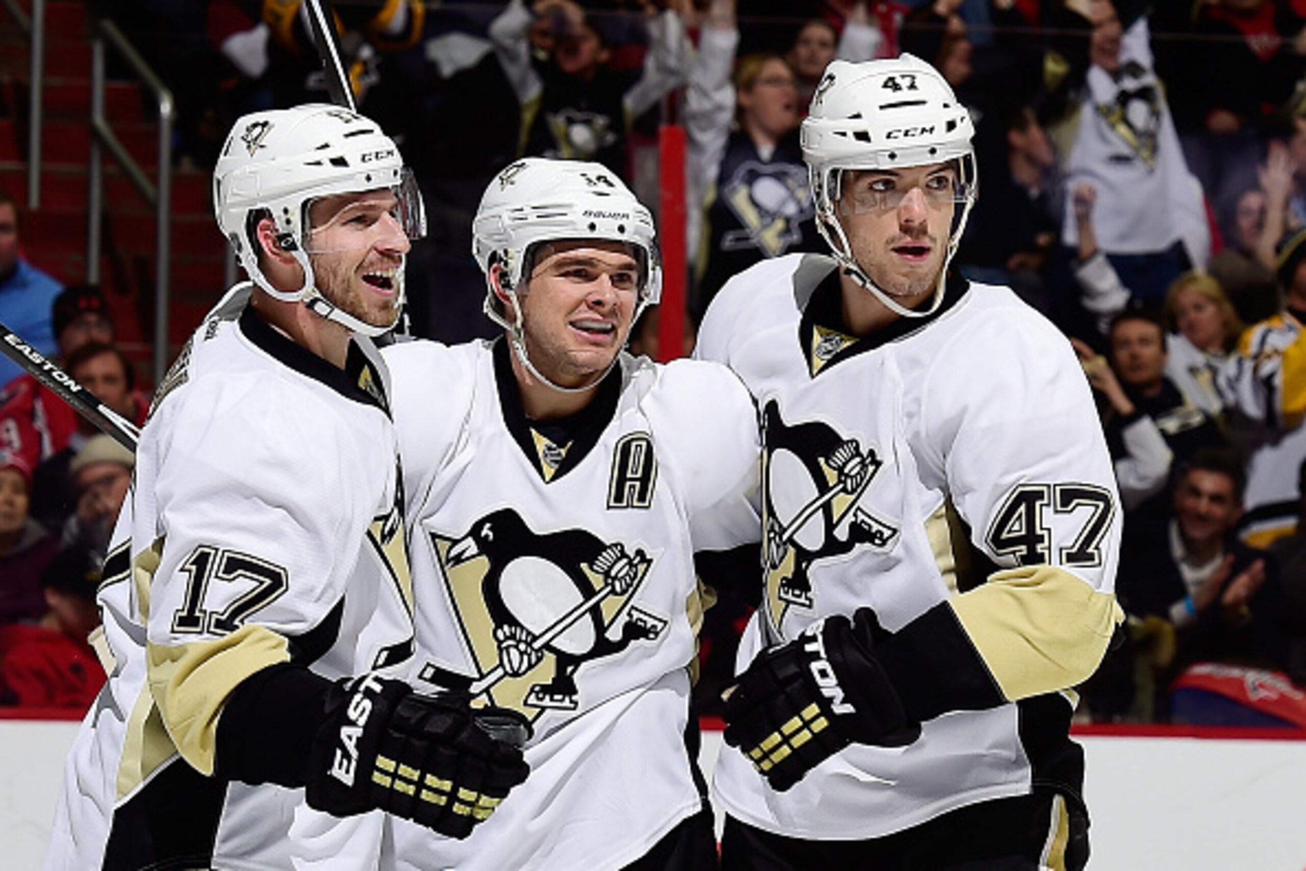 WASHINGTON, DC - FEBRUARY 25: Chris Kunitz #14 of the Pittsburgh Penguins celebrates with his teammates Blake Comeau #17 and Simon Despres #47 after scoring a goal in the third period during an NHL game against the Washington Capitals at Verizon Center o WASHINGTON, DC - FEBRUARY 25: Chris Kunitz #14 of the Pittsburgh Penguins celebrates with his teammates Blake Comeau #17 and Simon Despres #47 after scoring a goal in the third period during an NHL game against the Washington Capitals at Verizon Center o
