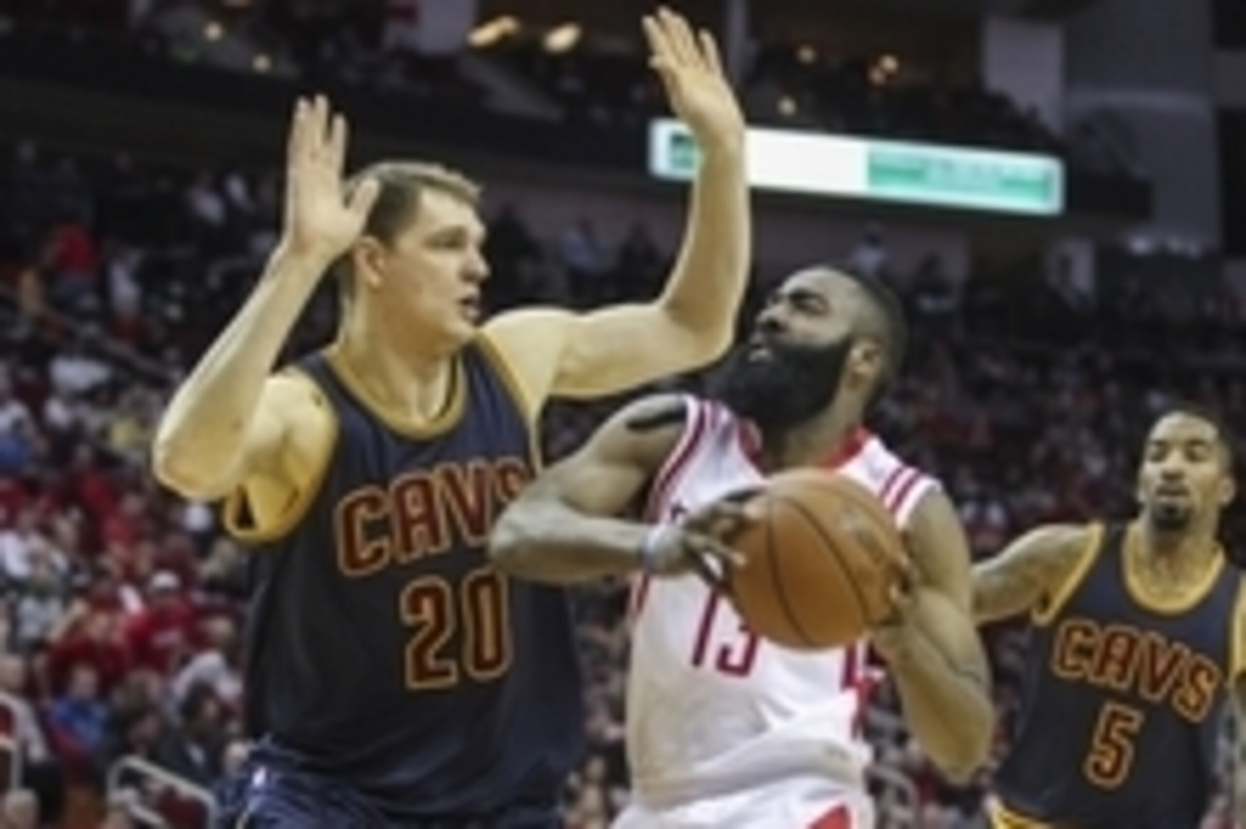Mar 1, 2015; Houston, TX, USA; Houston Rockets guard James Harden (13) drives the ball to the basket during the first quarter as Cleveland Cavaliers center Timofey Mozgov (20) defends at Toyota Center. Mandatory Credit: Troy Taormina-USA TODAY Sports