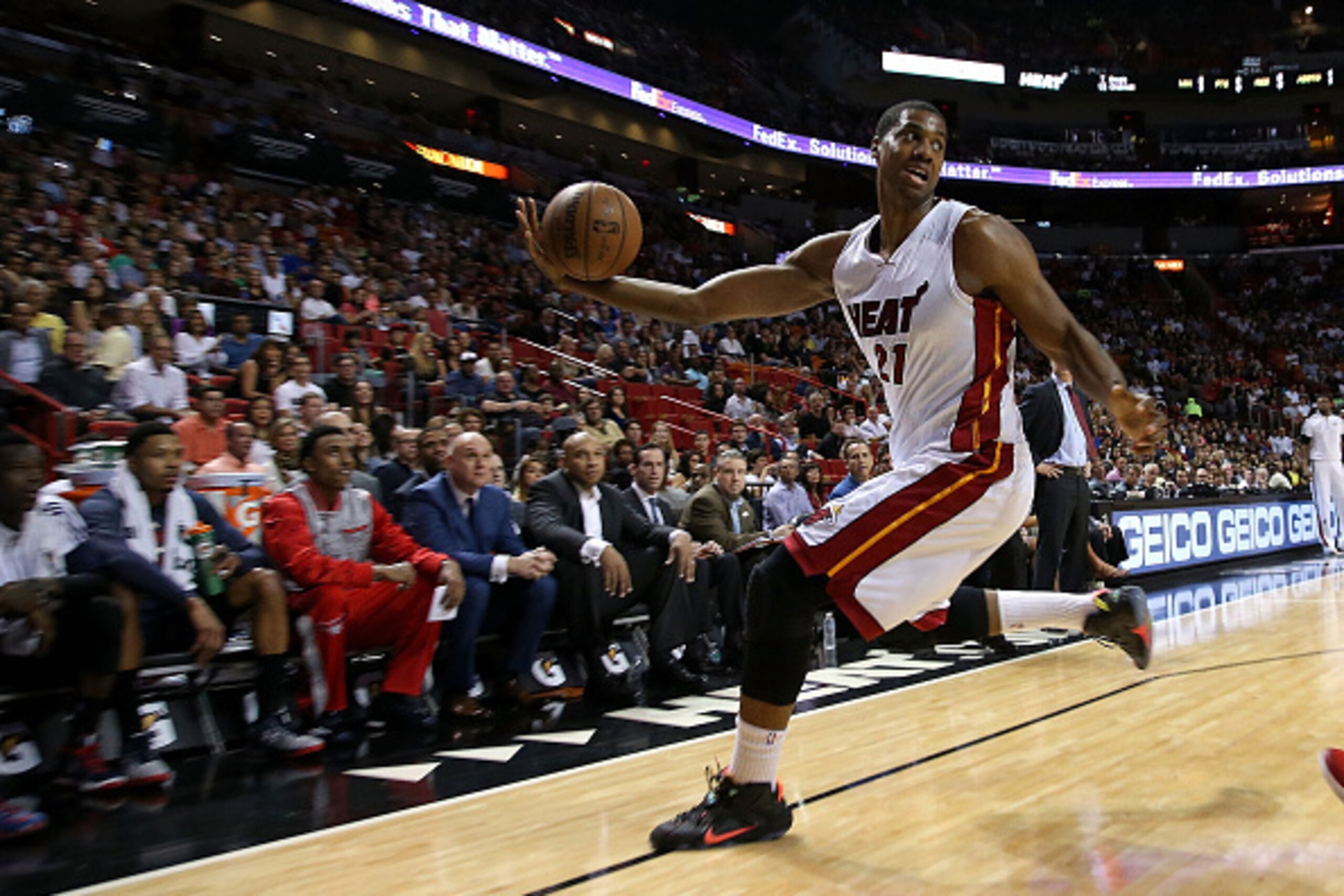 MIAMI, FL - FEBRUARY 28: Hassan Whiteside #21 of the Miami Heat saves the ball from going out of bounds during a game against the Atlanta Hawks at American Airlines Arena on February 28, 2015 in Miami, Florida. NOTE TO USER: User expressly acknowledges an