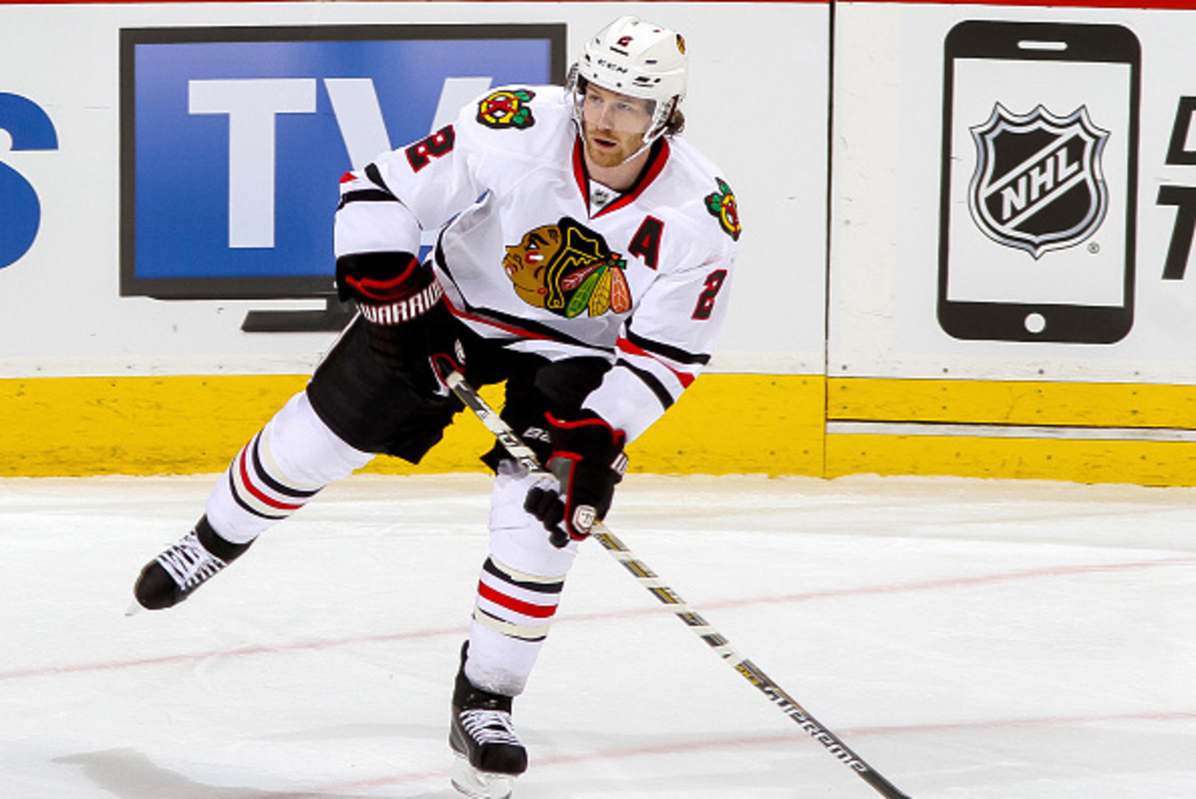 WINNIPEG, CANADA - FEBRUARY 6: Duncan Keith #2 of the Chicago Blackhawks plays the puck up the ice during second period action against the Winnipeg Jets on February 6, 2015 at the MTS Centre in Winnipeg, Manitoba, Canada. The Hawks defeated the Jets 2-1 i