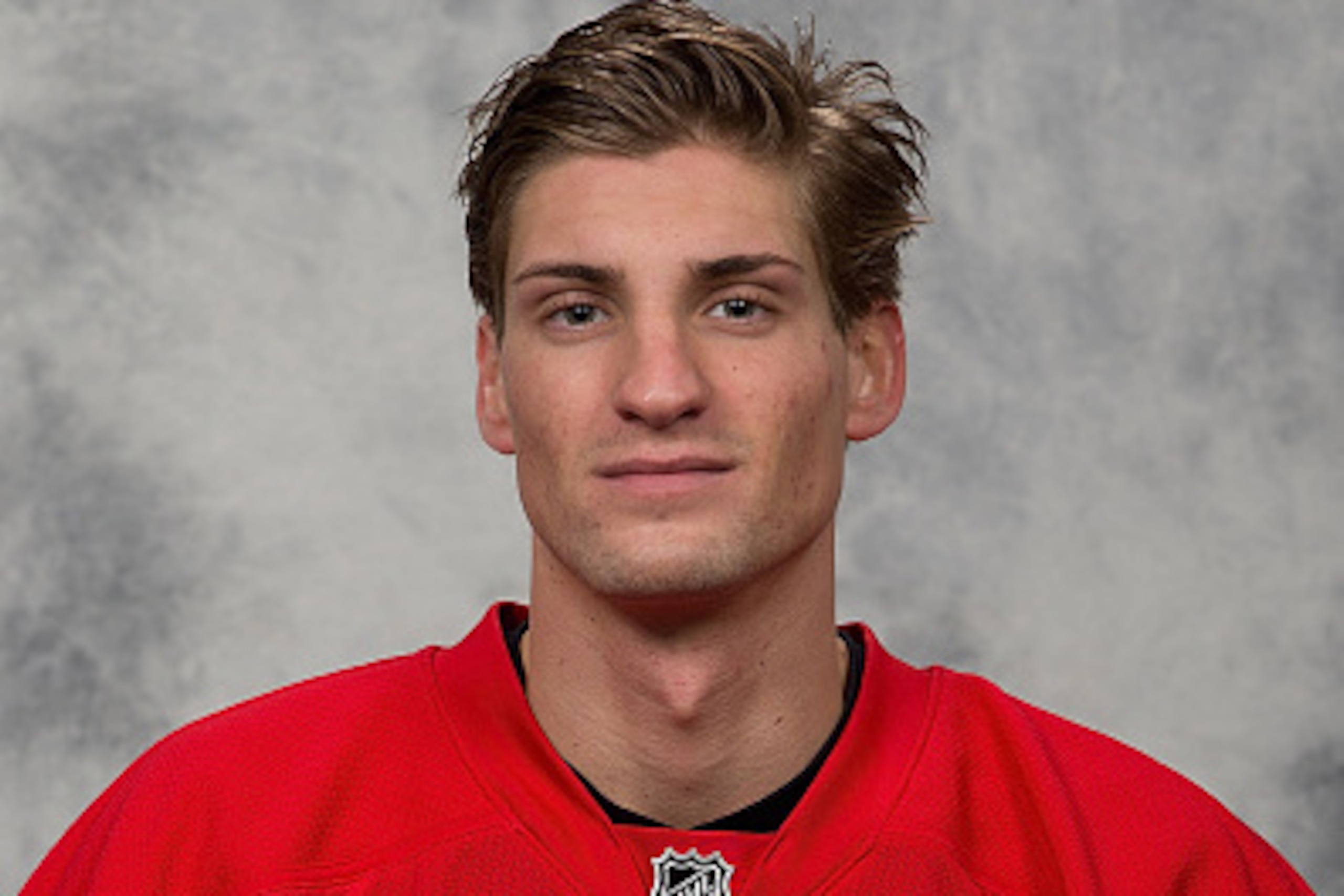 DETROIT, MI - SEPTEMBER 18:  Mattias Backman #25 of the Detroit Red Wings poses for his official headshot for the 2014-2015 season on September 18, 2014 at Joe Louis Arena in Detroit, Michigan. (Photo by Dave Reginek/NHLI via Getty Images)