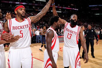HOUSTON, TX - MARCH 1: James Harden #13 of the Houston Rockets high fives teammates after the Cleveland Cavaliers during the game on March 1, 2015 at the Toyota Center in Houston, Texas. NOTE TO USER: User expressly acknowledges and agrees that, by downlo