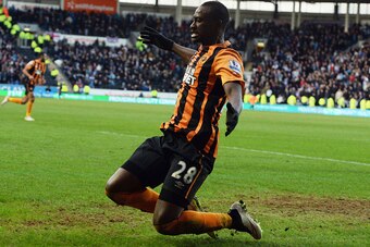 HULL, ENGLAND - FEBRUARY 21:  Dame N'Doye of Hull City celebrates as he scores their second goal during the Barclays Premier League match between Hull City and Queens Park Rangers at KC Stadium on February 21, 2015 in Hull, England.  (Photo by Nigel Roddi