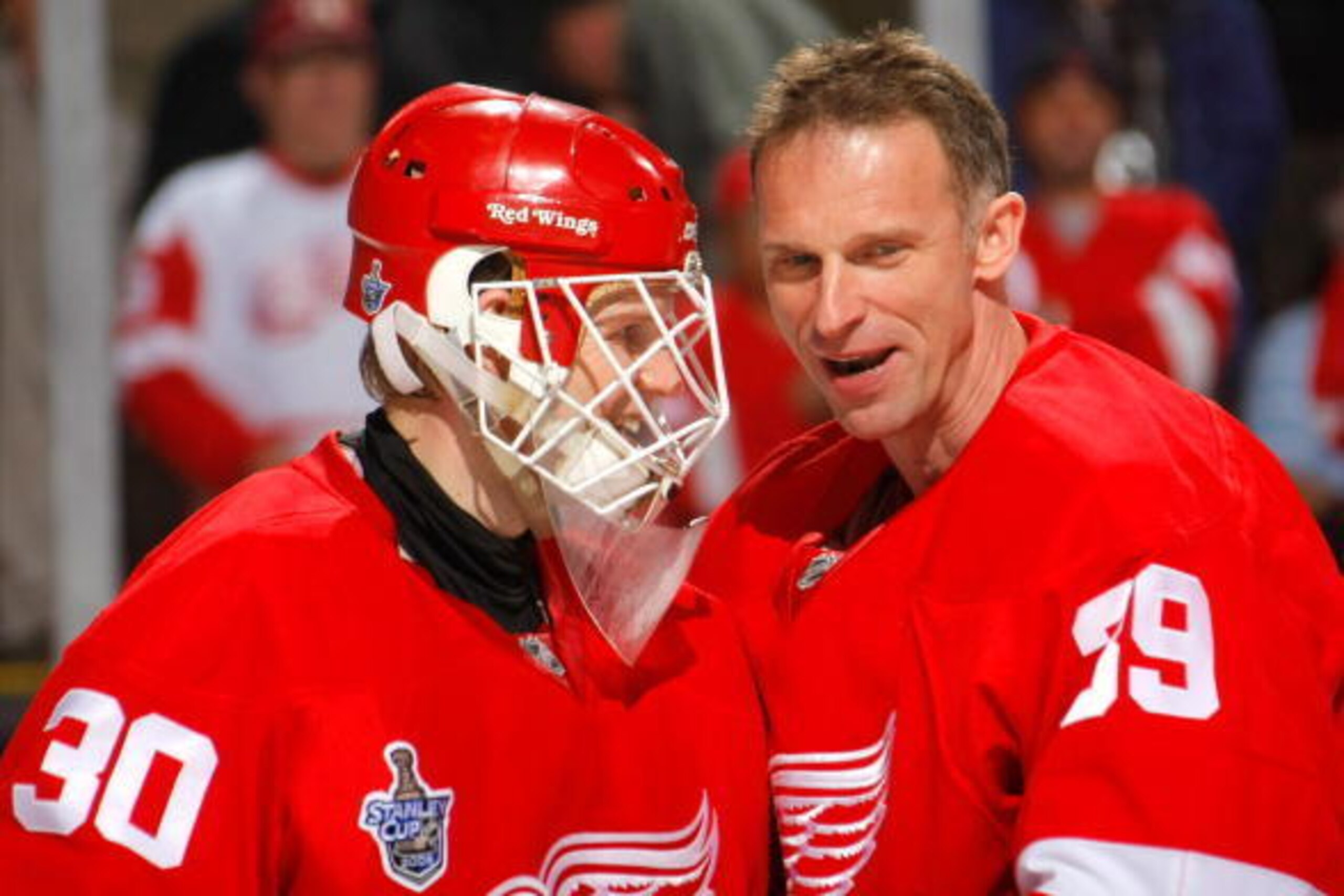 DETROIT - MAY 26:  Goaltenders Chris Osgood #30 and Dominik Hasek #39 of the Detroit Red Wings celebrate after wining game two of the 2008 NHL Stanley Cup Finals against the Pittsburgh Penguins at Joe Louis Arena on May 26, 2008 in Detroit, Michigan. The 