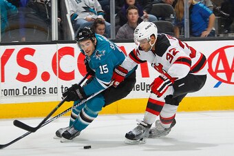 SAN JOSE, CA - JANUARY 19: James Sheppard #15 of the San Jose Sharks skates after the puck against Mark Fraser #32 of the New Jersey Devils during an NHL game on January 19, 2015 at SAP Center in San Jose, California. (Photo by Don Smith/NHLI via Getty Im