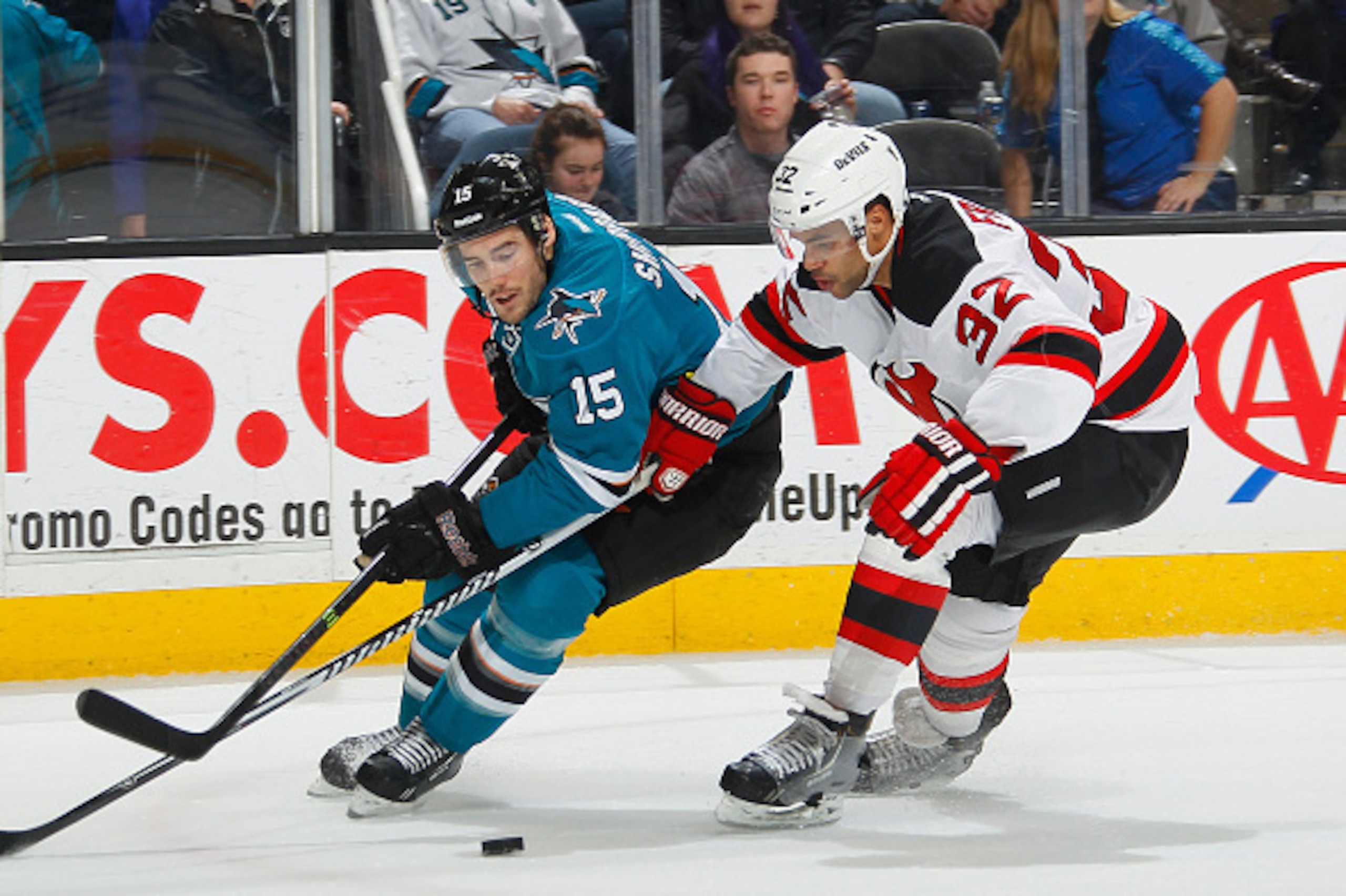 SAN JOSE, CA - JANUARY 19: James Sheppard #15 of the San Jose Sharks skates after the puck against Mark Fraser #32 of the New Jersey Devils during an NHL game on January 19, 2015 at SAP Center in San Jose, California. (Photo by Don Smith/NHLI via Getty Im