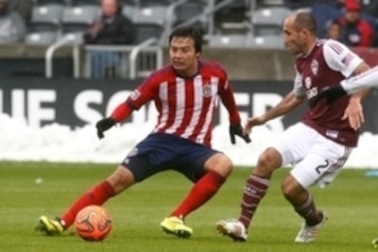 May 11, 2014; Commerce City, CO, USA; Chivas USA forward Erick Torres (9) dribbles the ball against Colorado Rapids midfielder Nick LaBrocca (2) in the second half at Dick's Sporting Goods Park. Chivas USA defeated the Rapids 3-1. Mandatory Credit: Isaiah