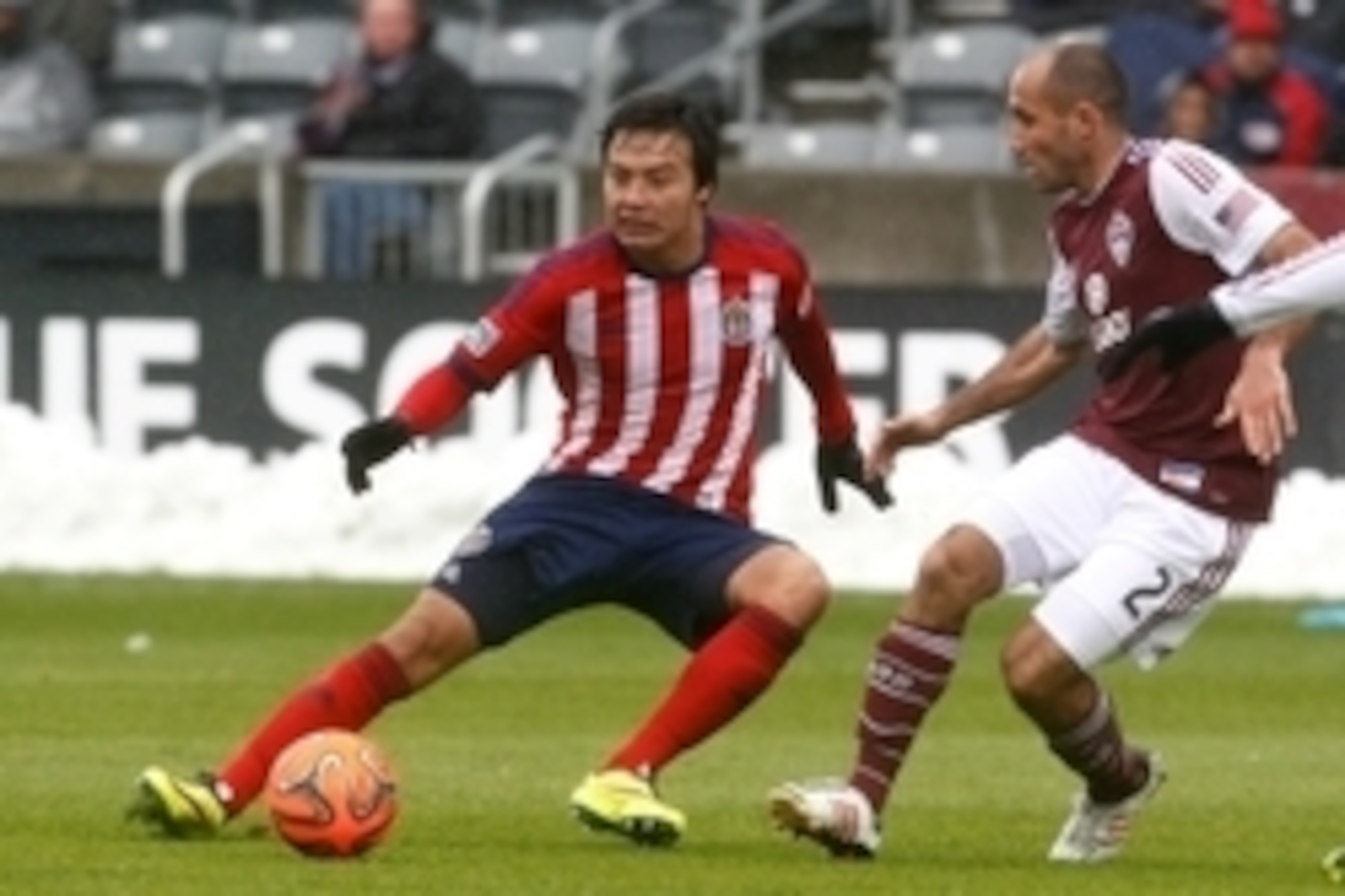 May 11, 2014; Commerce City, CO, USA; Chivas USA forward Erick Torres (9) dribbles the ball against Colorado Rapids midfielder Nick LaBrocca (2) in the second half at Dick's Sporting Goods Park. Chivas USA defeated the Rapids 3-1. Mandatory Credit: Isaiah