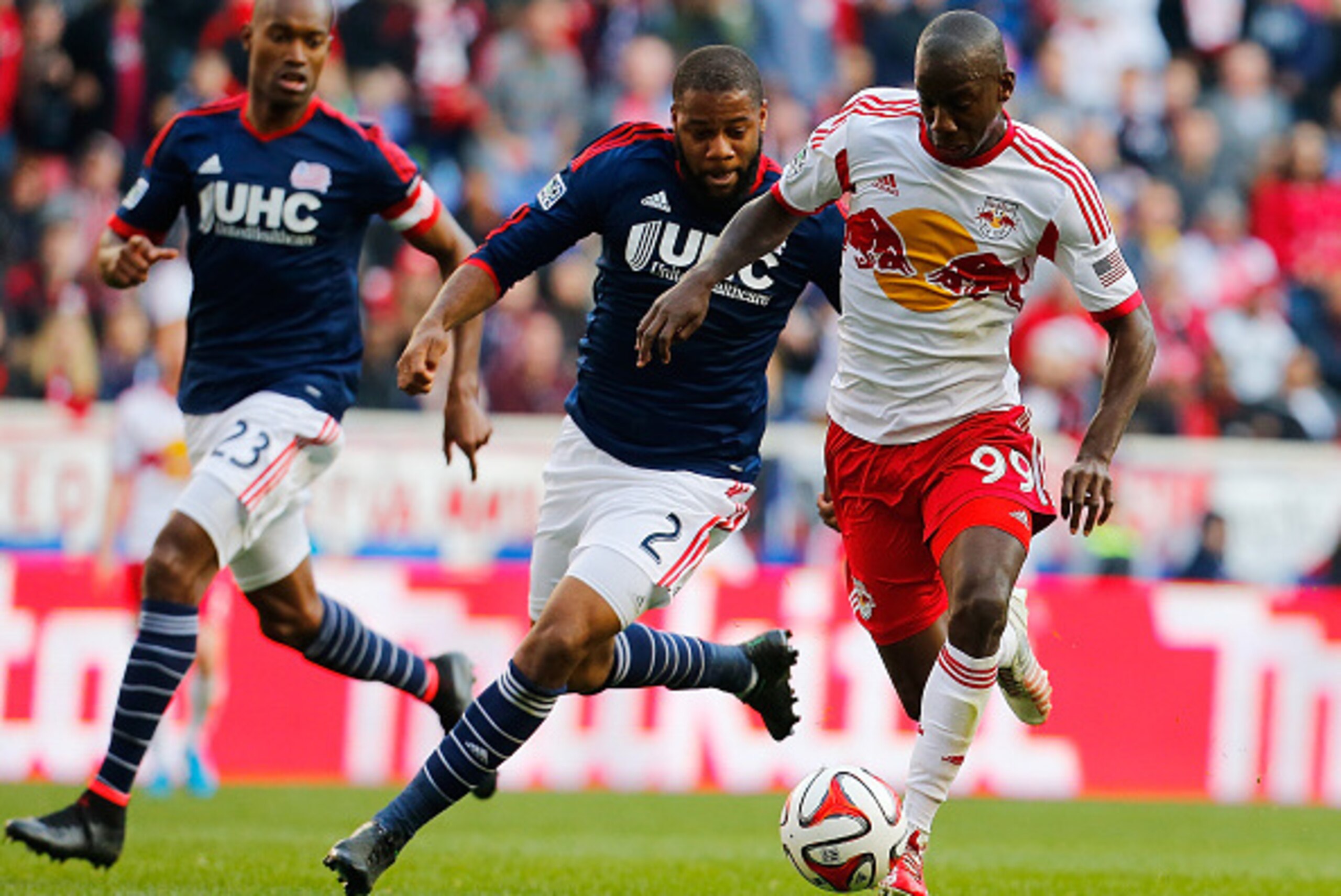 HARRISON, NJ - NOVEMBER 23:  Bradley Wright-Phillips #99 of New York Red Bulls and Andrew Farrell #2 of New England Revolution vie for the ball during the Eastern Conference Final - Leg 1 at Red Bull Arena on November 23, 2014 in Harrison, New Jersey. Rev