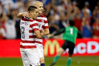KANSAS CITY, KS - OCTOBER 16:  Michael Bradley #4 of the USA congratulates Clint Dempsey #8 after Dempsey scored a goal during the first half fo the World Cup Qualifying match against Guatemala at LiveStrong Sporting Park on October 16, 2012 in Kansas Cit