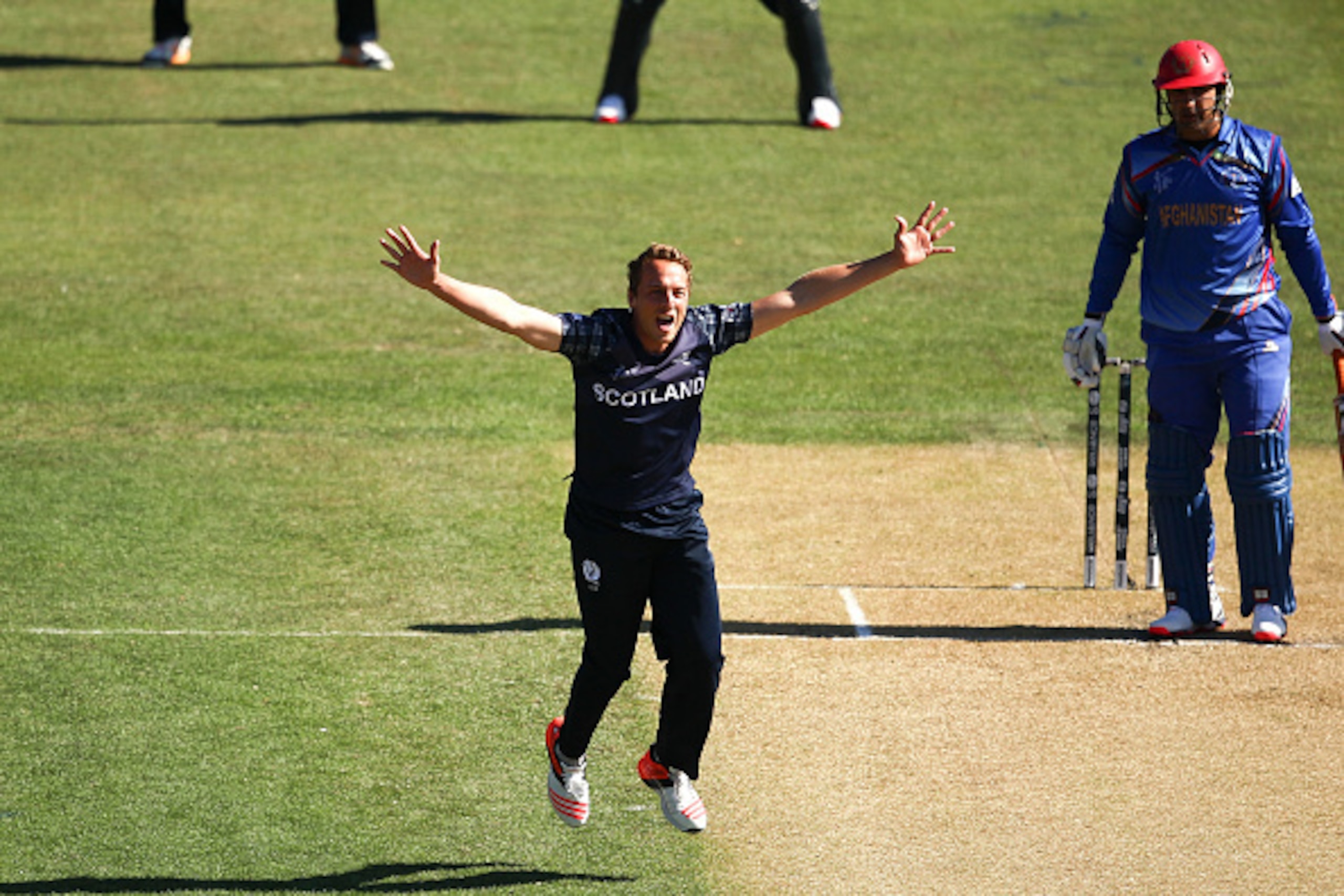DUNEDIN, NEW ZEALAND - FEBRUARY 26: Josh Davey of Scotland celebrates a wicket during the 2015 ICC Cricket World Cup match between Afghanistan and Scotland at University Oval on February 26, 2015 in Dunedin, New Zealand.  (Photo by Martin Hunter/Getty Ima