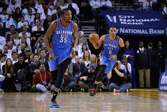 OAKLAND, CA - JANUARY 05:  Russell Westbrook #0 and Kevin Durant #35 of the Oklahoma City Thunder in action against the Golden State Warriors at ORACLE Arena on January 5, 2015 in Oakland, California.  NOTE TO USER: User expressly acknowledges and agrees 