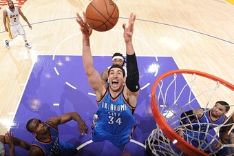 LOS ANGELES, CA - MARCH 1:  Enes Kanter #34 of the Oklahoma City Thunder grabs the rebound against the Los Angeles Lakers on March 1, 2015 at Staples Center in Los Angeles, California. NOTE TO USER: User expressly acknowledges and agrees that, by download