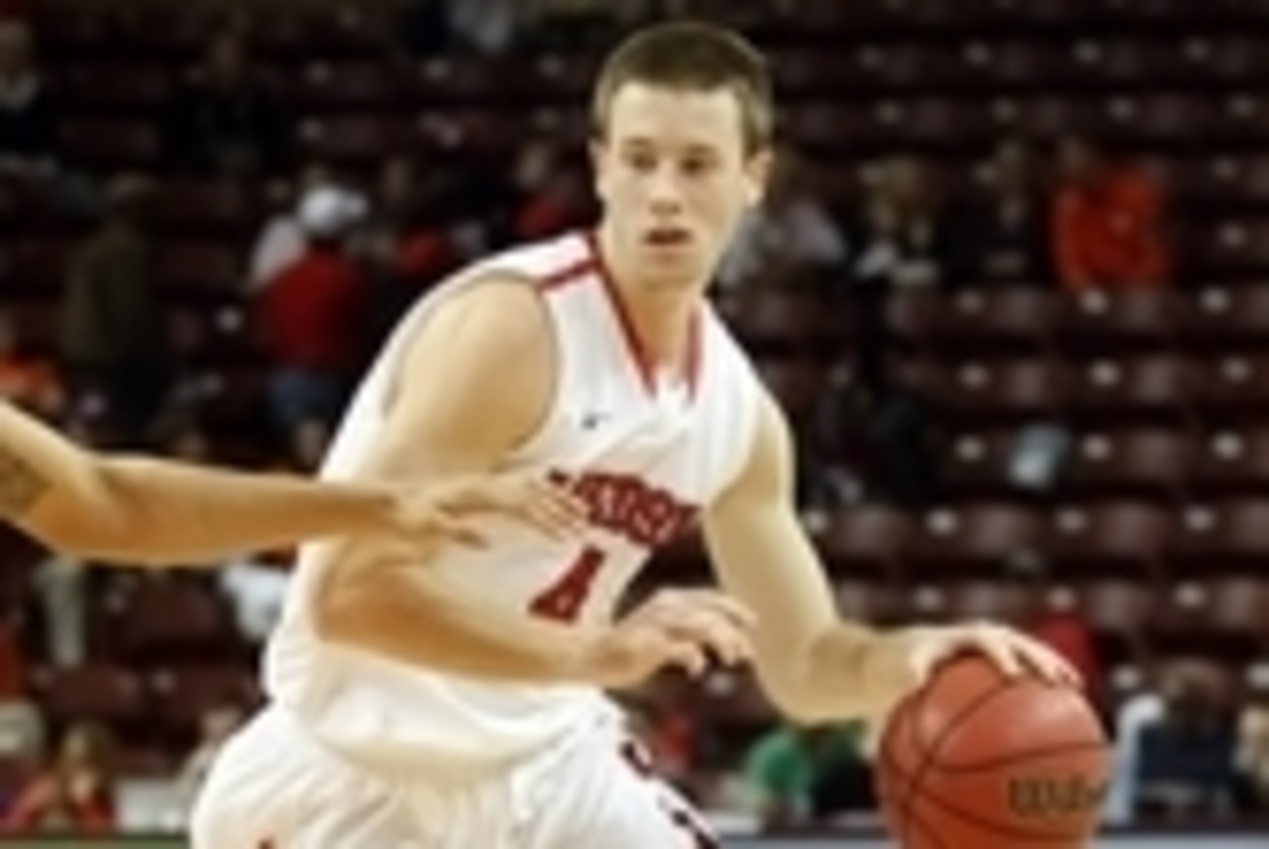 Nov 21, 2013; Charleston, SC, USA; Davidson Wildcats guard Tyler Kalinoski (4) drives to the basket during the first half against the Georgia Bulldogs at TD Arena. Mandatory Credit: Jeremy Brevard-USA TODAY Sports
