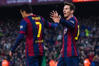 BARCELONA, SPAIN - FEBRUARY 15:  Lionel Messi of FC Barcelona celebrates with his teammate Pedro Rodriguez of FC Barcelona after scoring his team's third goal during the La Liga match between FC Barcelona and Levante UD at Camp Nou on February 15, 2015 in