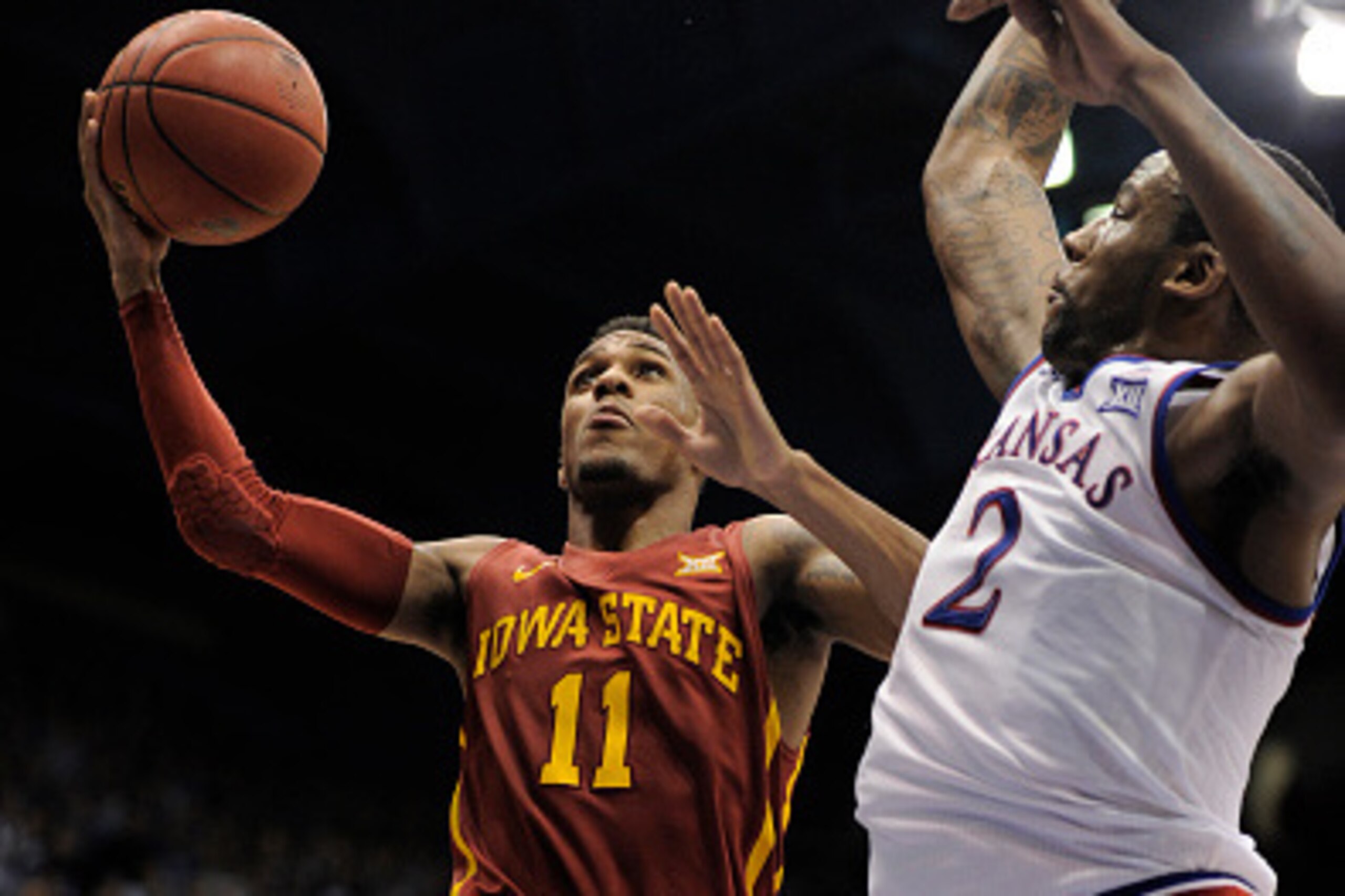 LAWRENCE, KS - FEBRUARY 2:  Monte Morris #11 of the Iowa State Cyclones lays the ball up against Cliff Alexander #2 of the Kansas Jayhawks in the second half at Allen Field House on February 2, 2015 in Lawrence, Kansas. Kansas won 89-76. (Photo by Ed Zurg