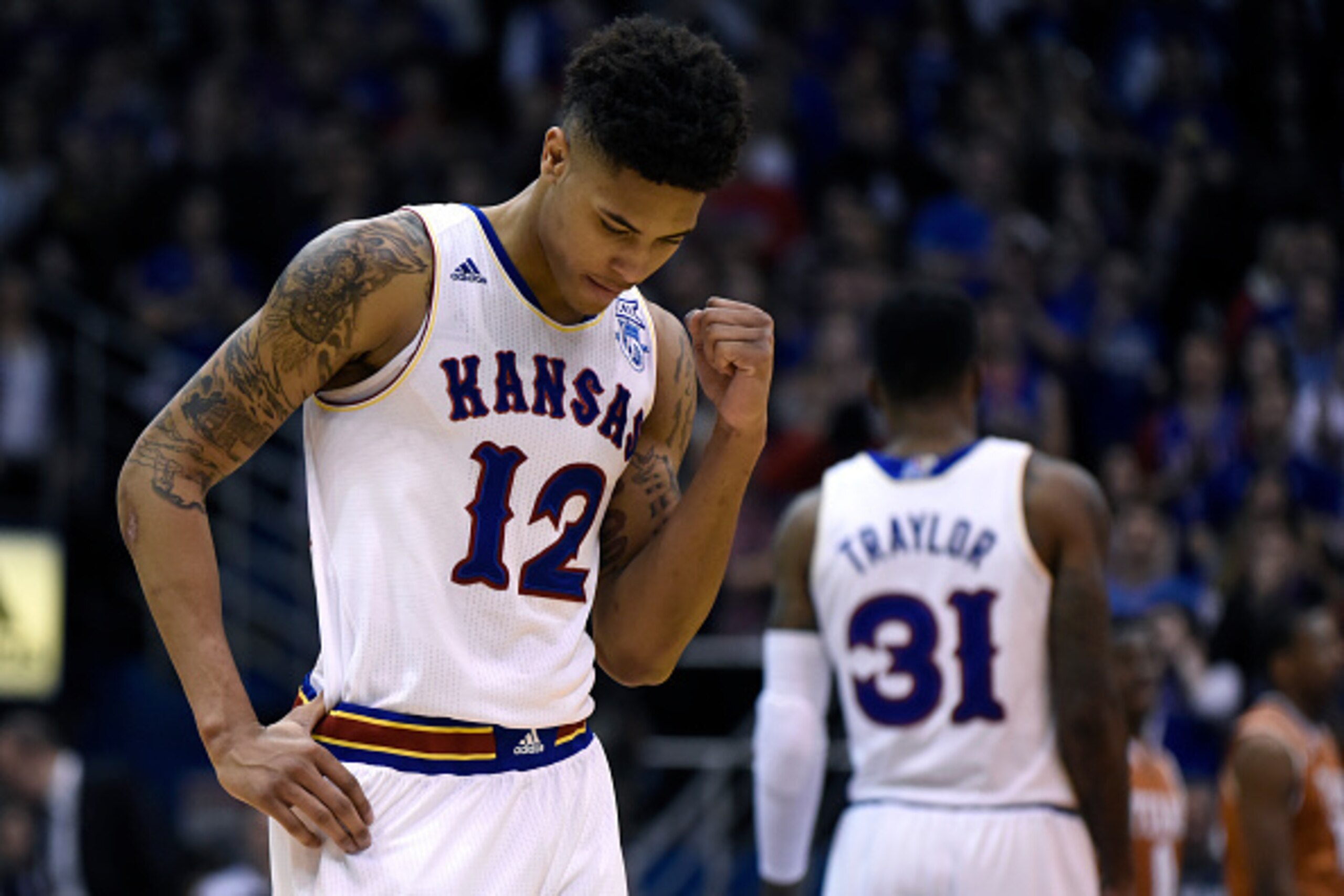 LAWRENCE, KS - FEBRUARY 28:  Kelly Oubre Jr. #12 of the Kansas Jayhawks pumps his fist after a Kansas basket during a game against the Texas Longhorns in the second half at Allen Fieldhouse on February 28, 2015 in Lawrence, Kansas. Kansas won 69-64. (Phot