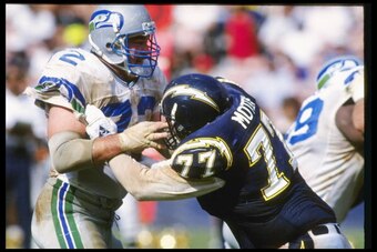 4 Oct 1992: Defensive lineman Joe Nash of the Seattle Seahawks (left) and San Diego Chargers offensive lineman Eric Moten tangle up during a game at Jack Murphy Stadium in San Diego, California. The Chargers won the game, 17-6.
