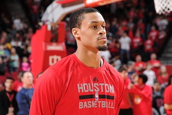 HOUSTON, TX - FEBRUARY 21: K.J. McDaniels #32 of the Houston Rockets stands for the national anthem before a game against the Toronto Raptors on February 21, 2015 at the Toyota Center in Houston, Texas. NOTE TO USER: User expressly acknowledges and agrees