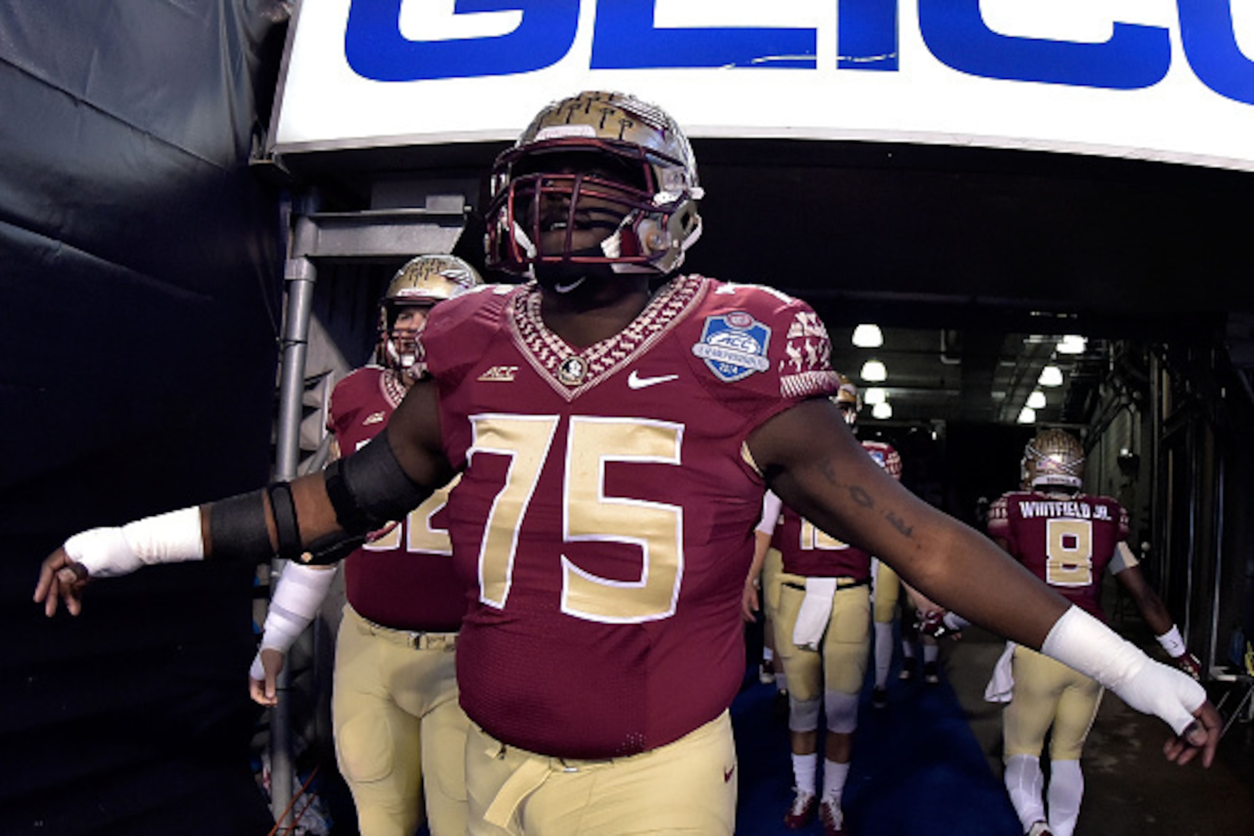 CHARLOTTE, NC - DECEMBER 06:  Cameron Erving #75 of the Florida State Seminoles takes the fied for warmups before their Atlantic Coast Conference championship game against the Georgia Tech Yellow Jackets at Bank of America Stadium on December 6, 2014 in G